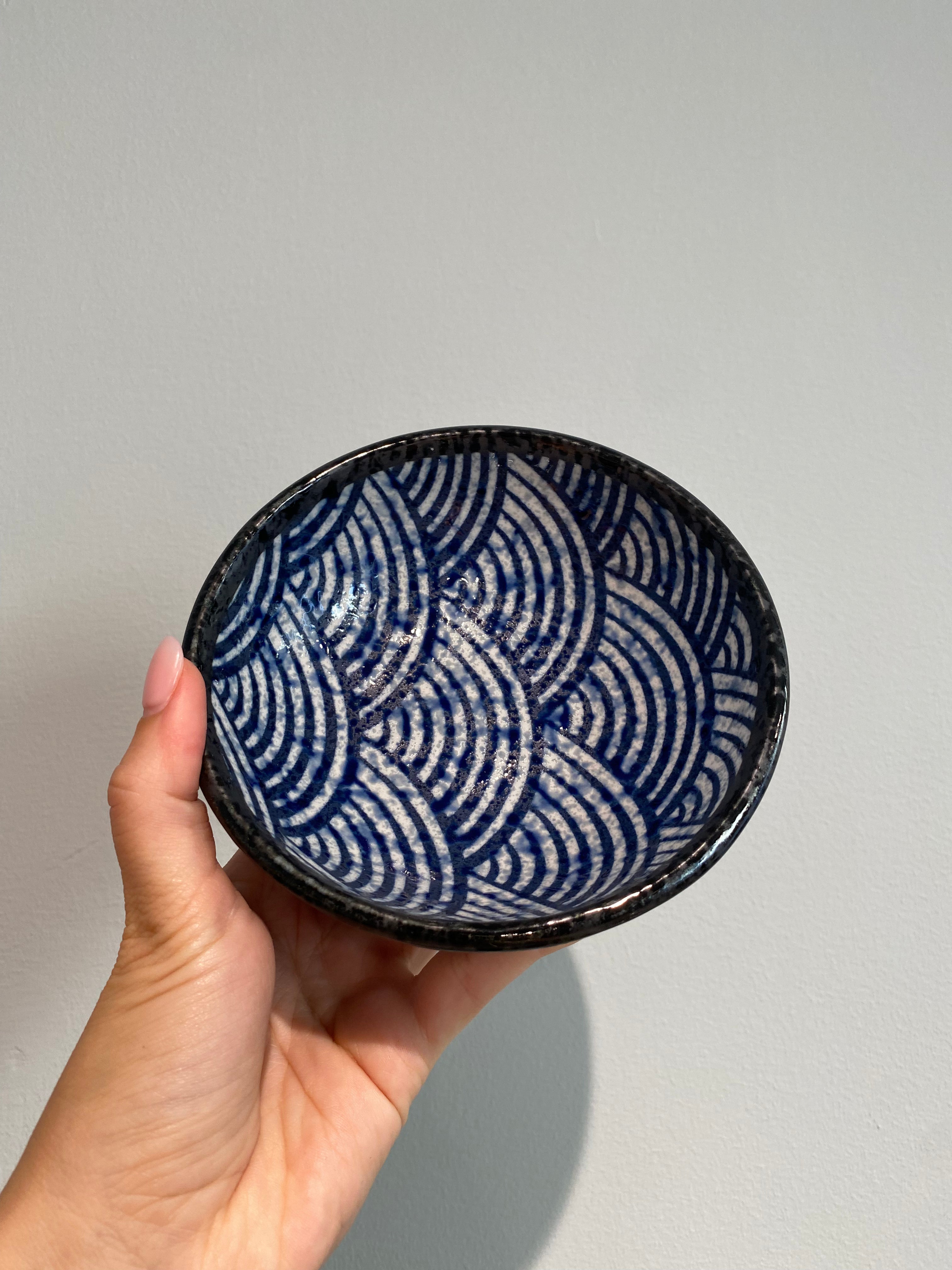 Small bowl with wave pattern and dark rim