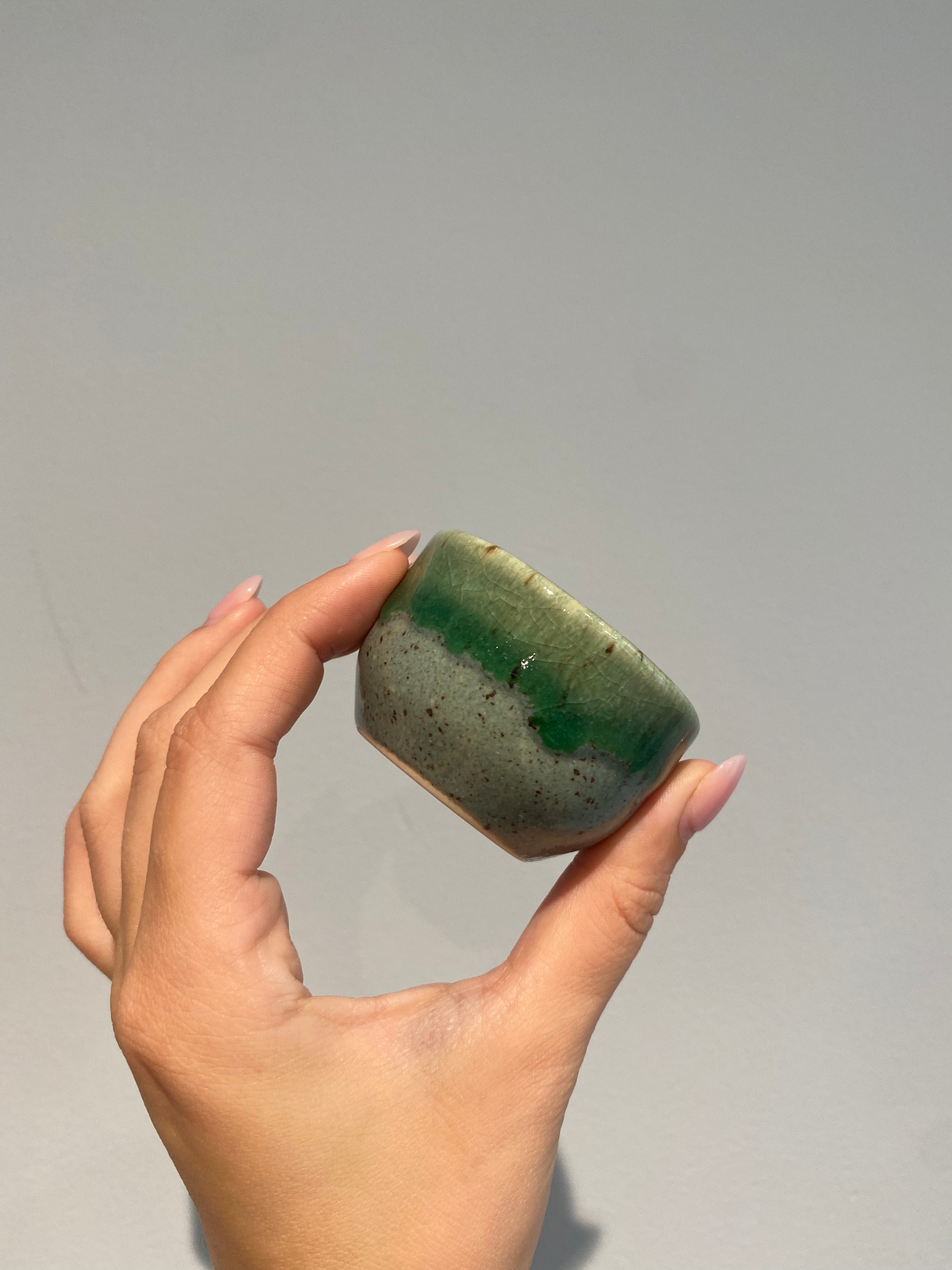 Sake cup with green shades of glaze