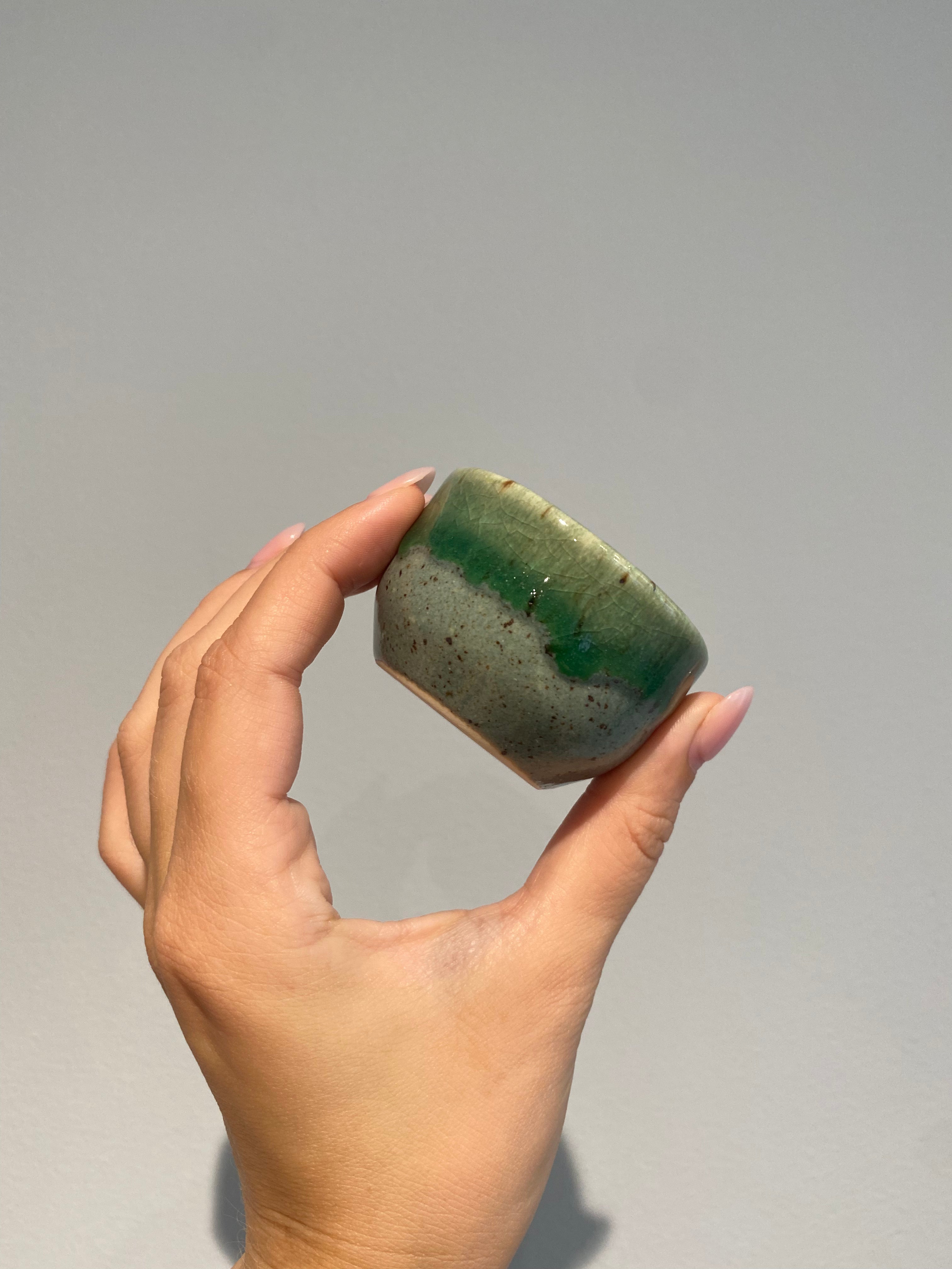 Sake cup with green shades of glaze