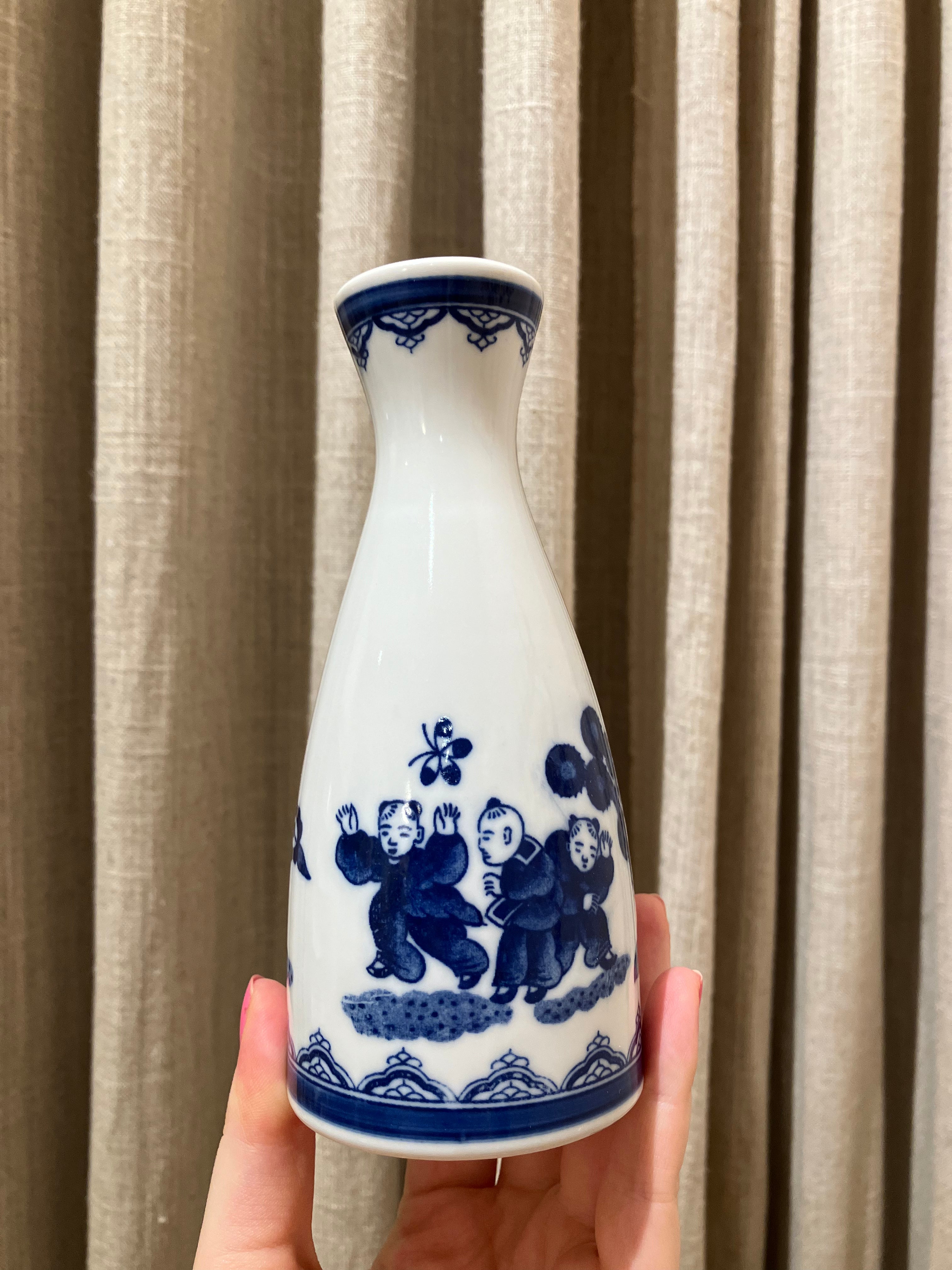 Sake jug with blue Japanese motif