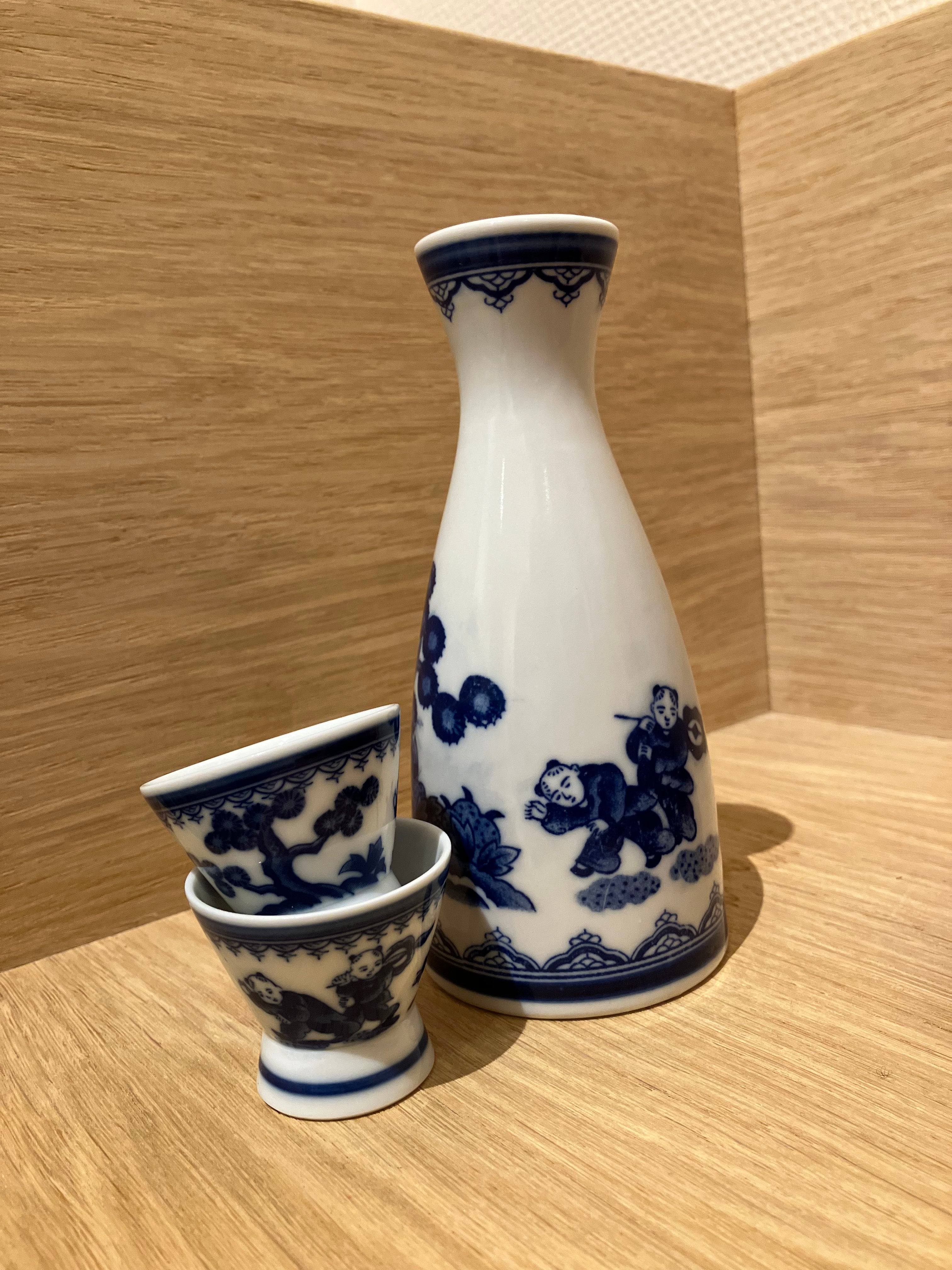 Sake jug with blue Japanese motif