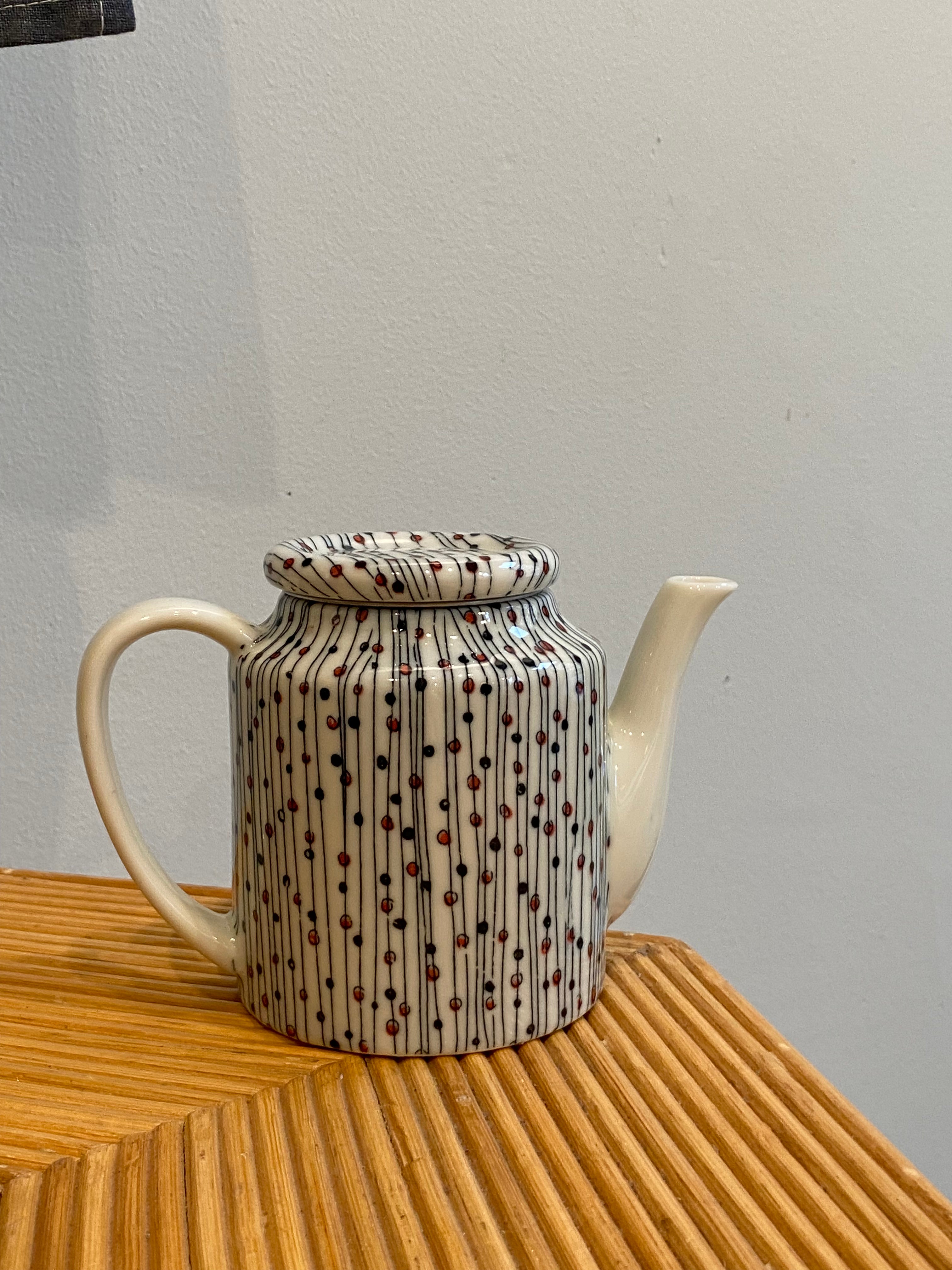 Small teapot with lines and dots