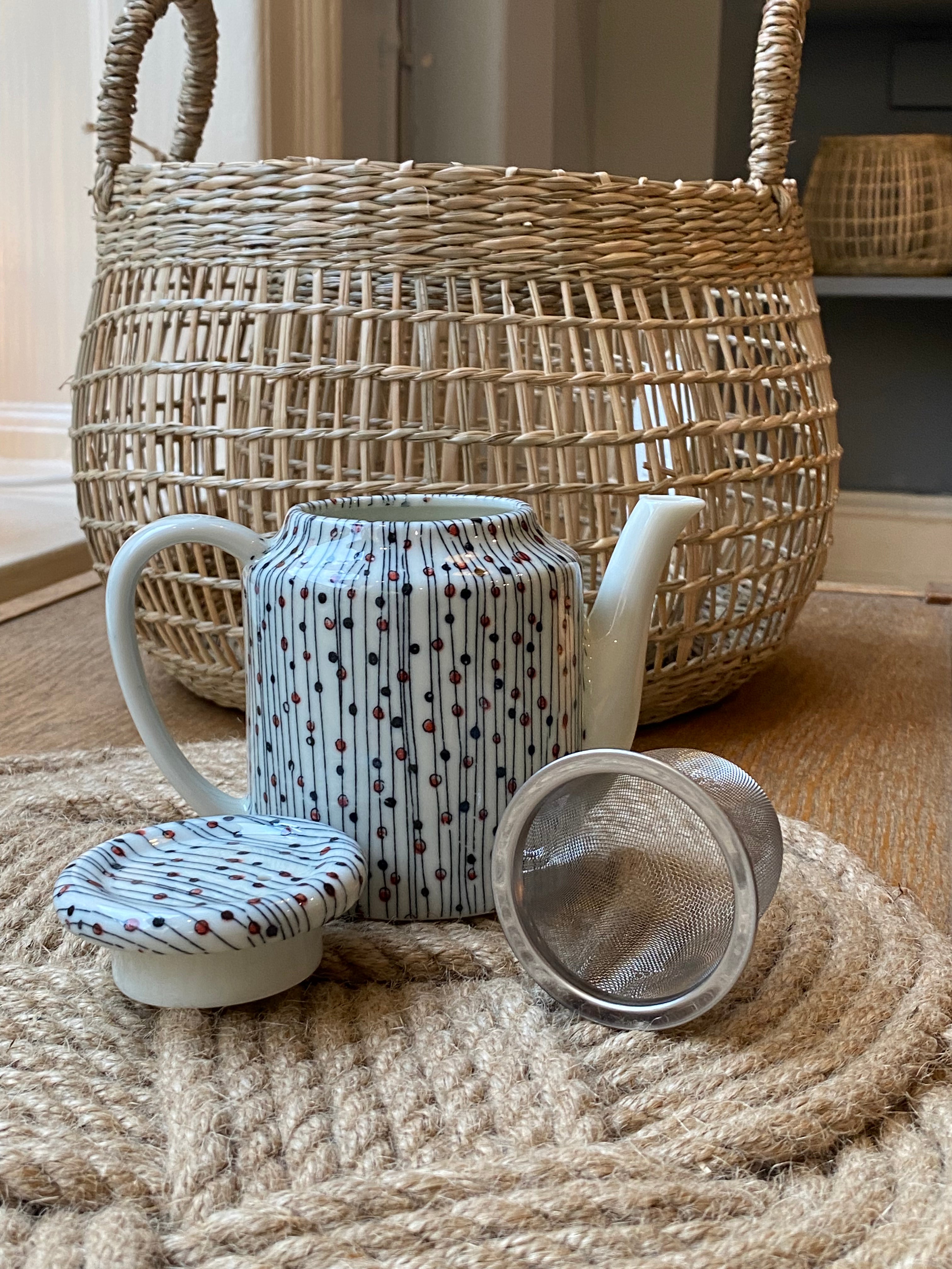 Small teapot with lines and dots