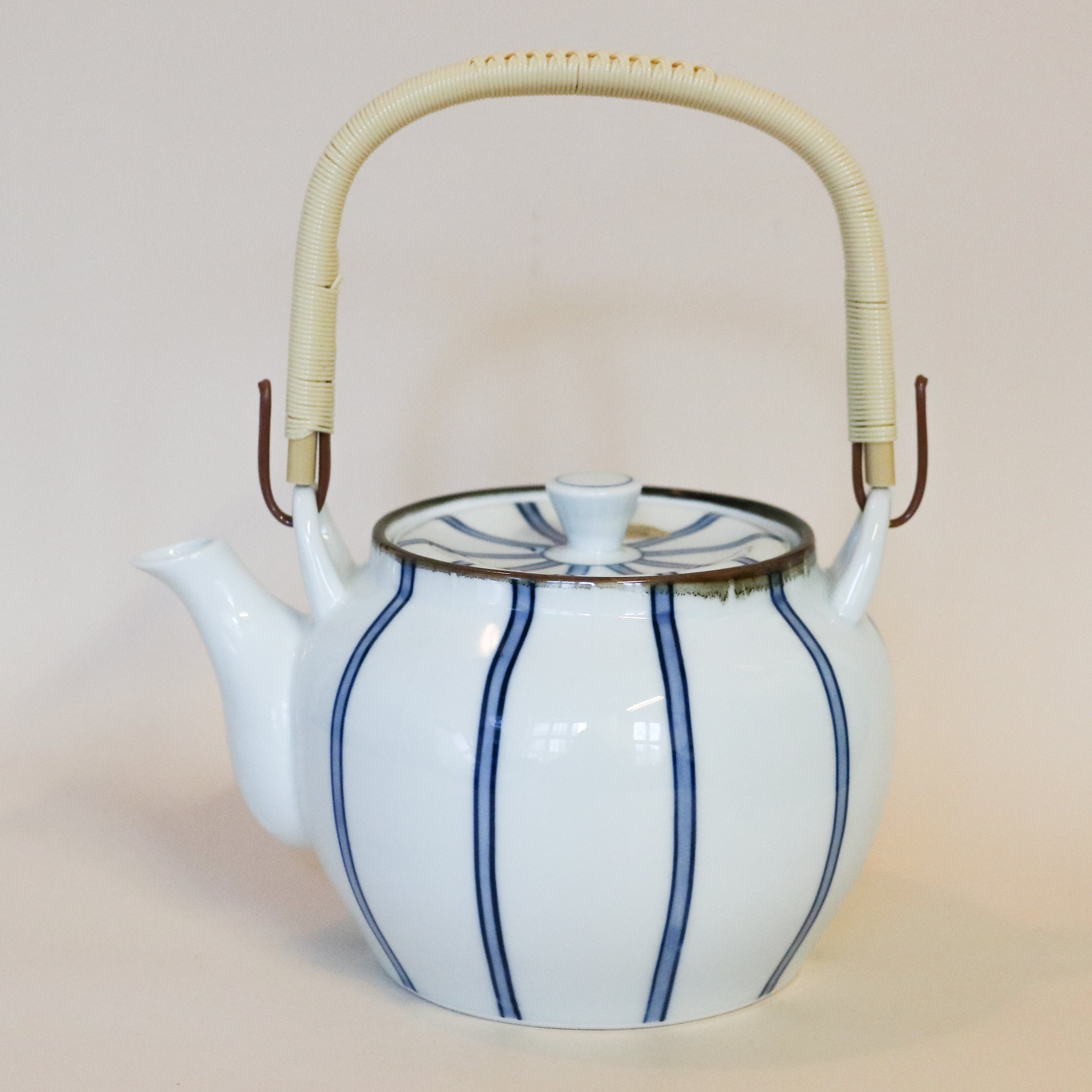 Teapot with white glaze and narrow dark blue stripes