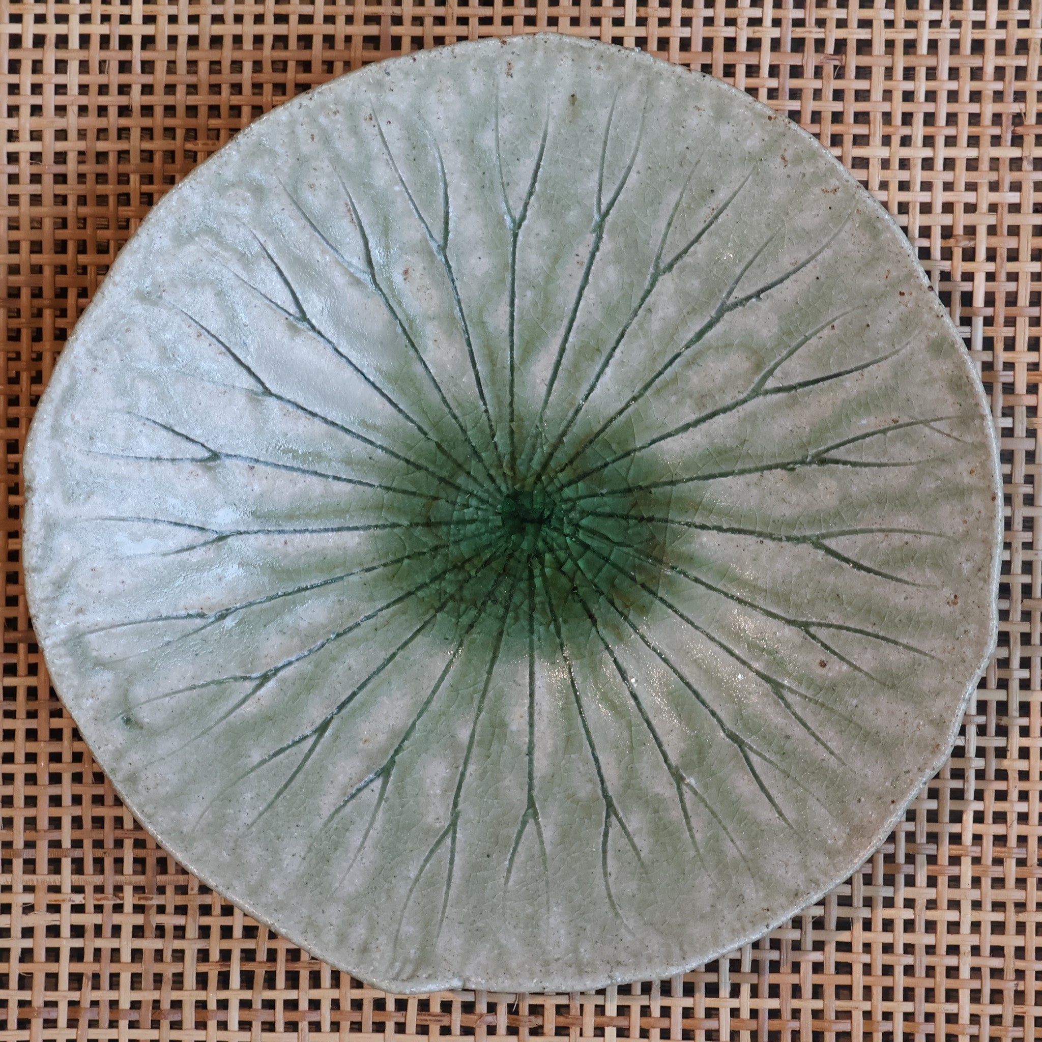 Small round dish with green leaf pattern