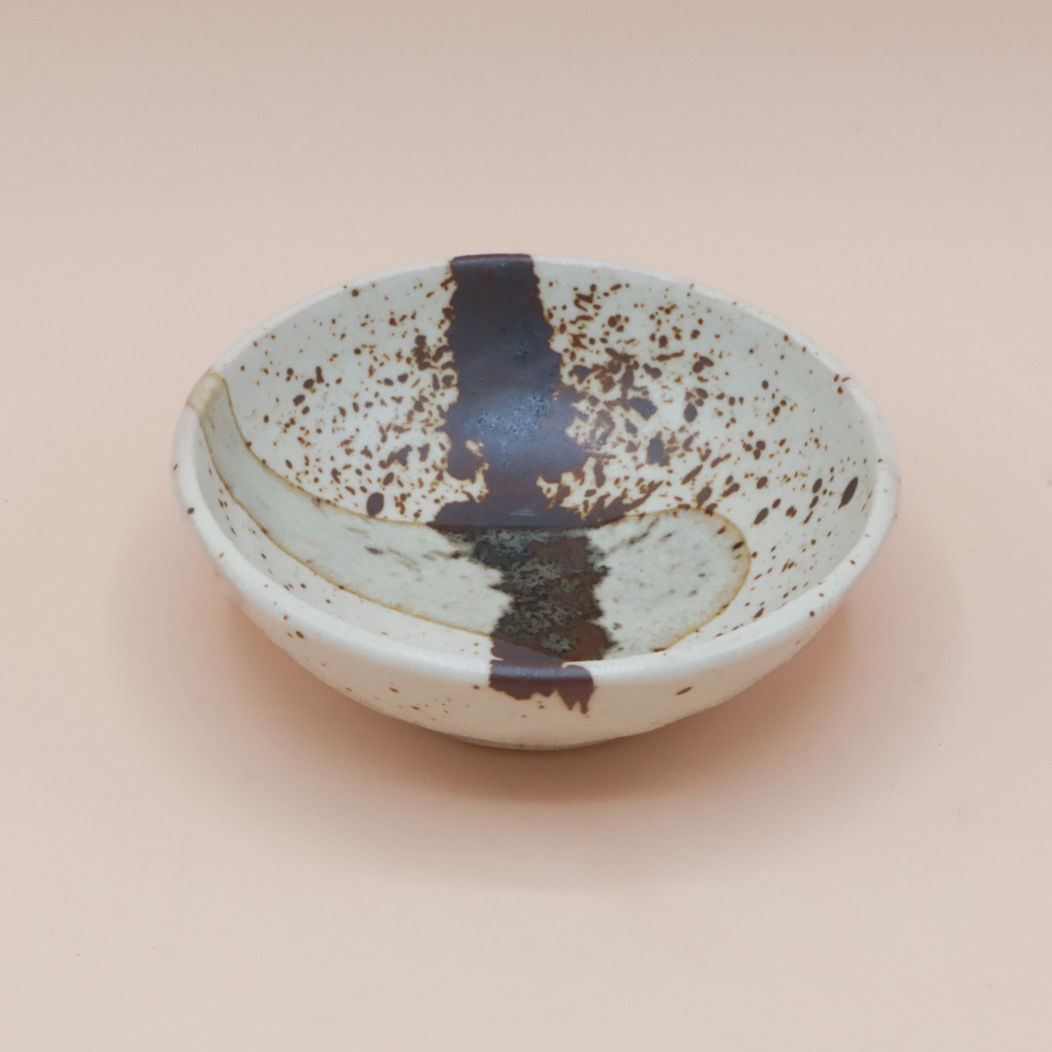 Bowl with brown splash and glaze stripe