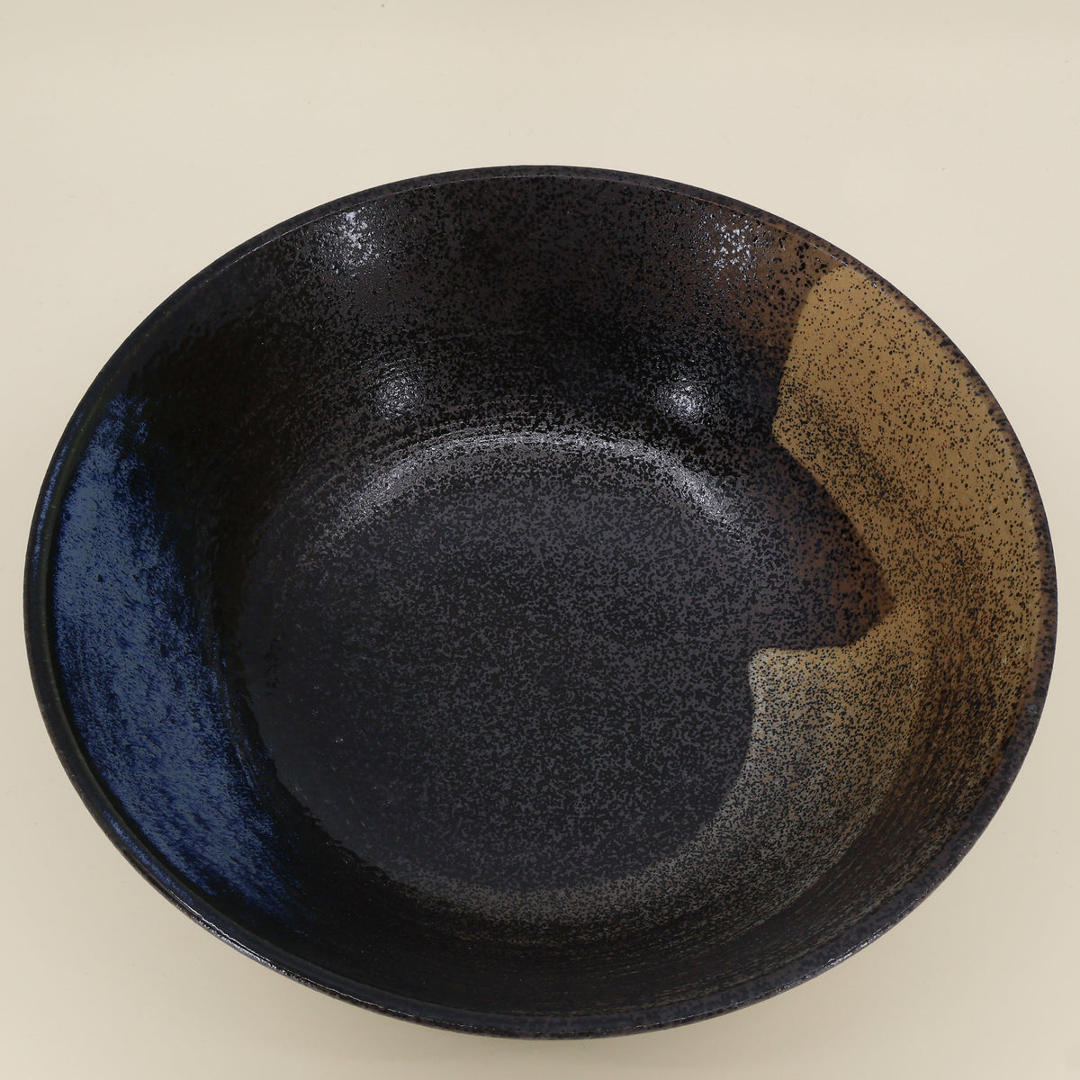 Ramen bowl with metallic glaze and blue/brown hues