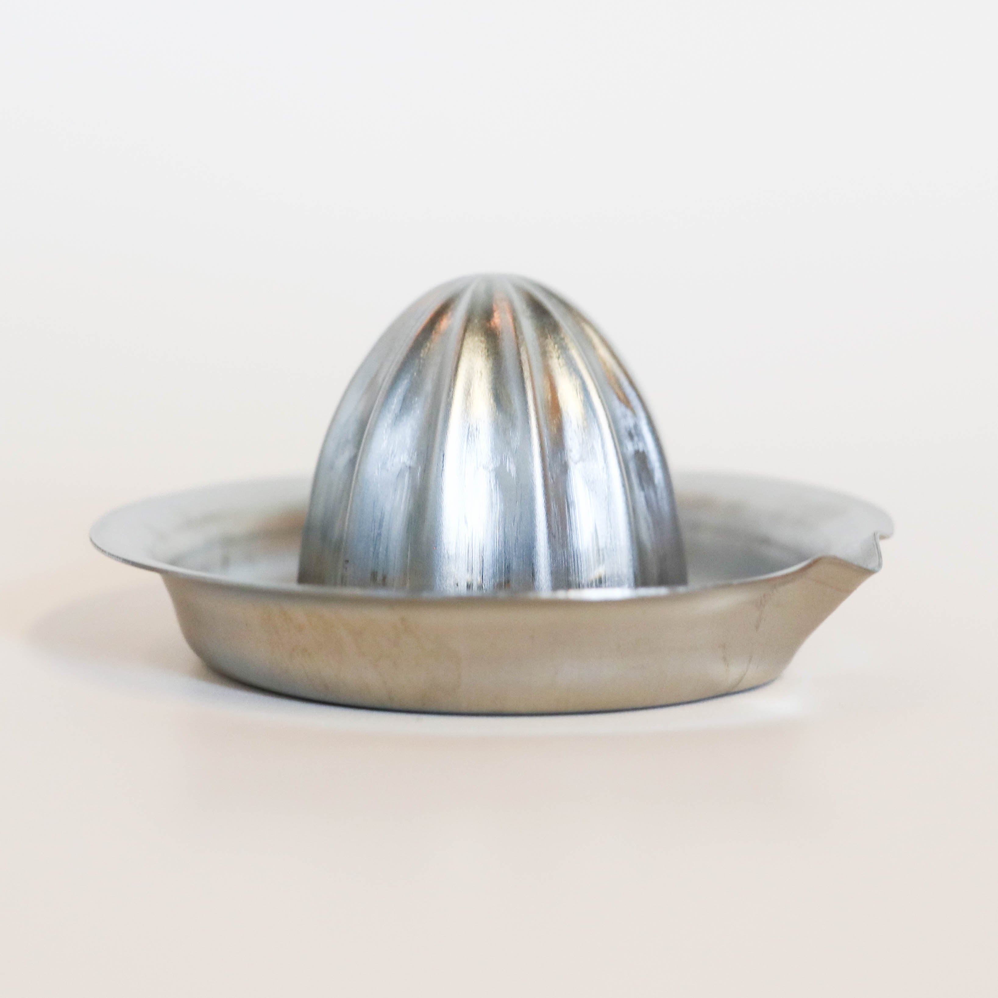 (Missing price and quantity) Citrus press in steel