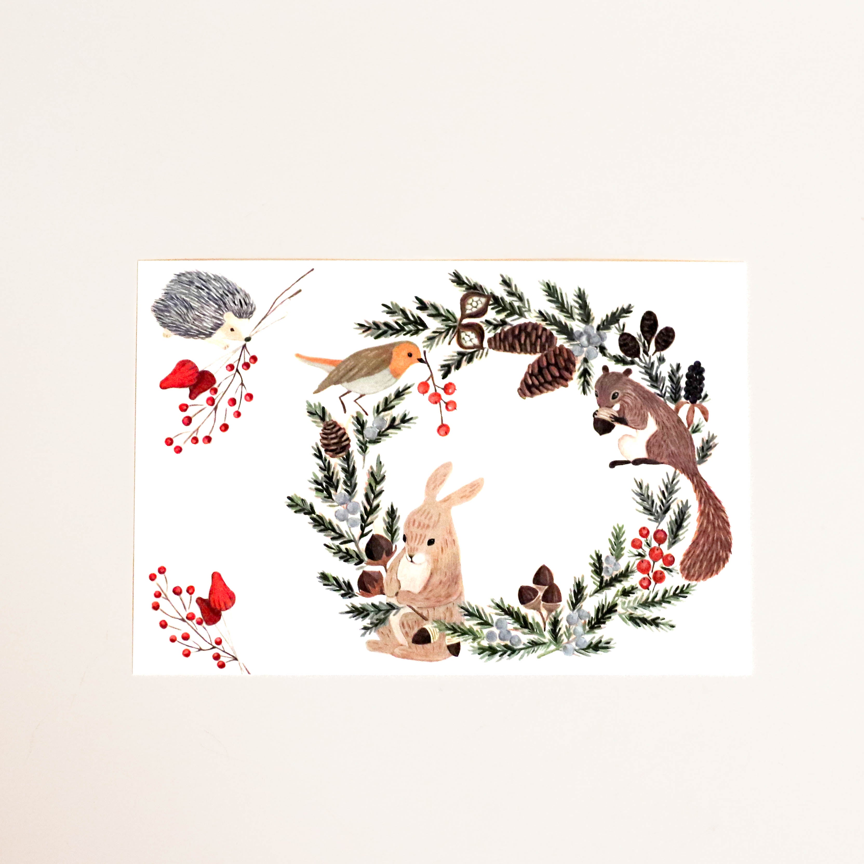 Postcard with wreath and forest animals