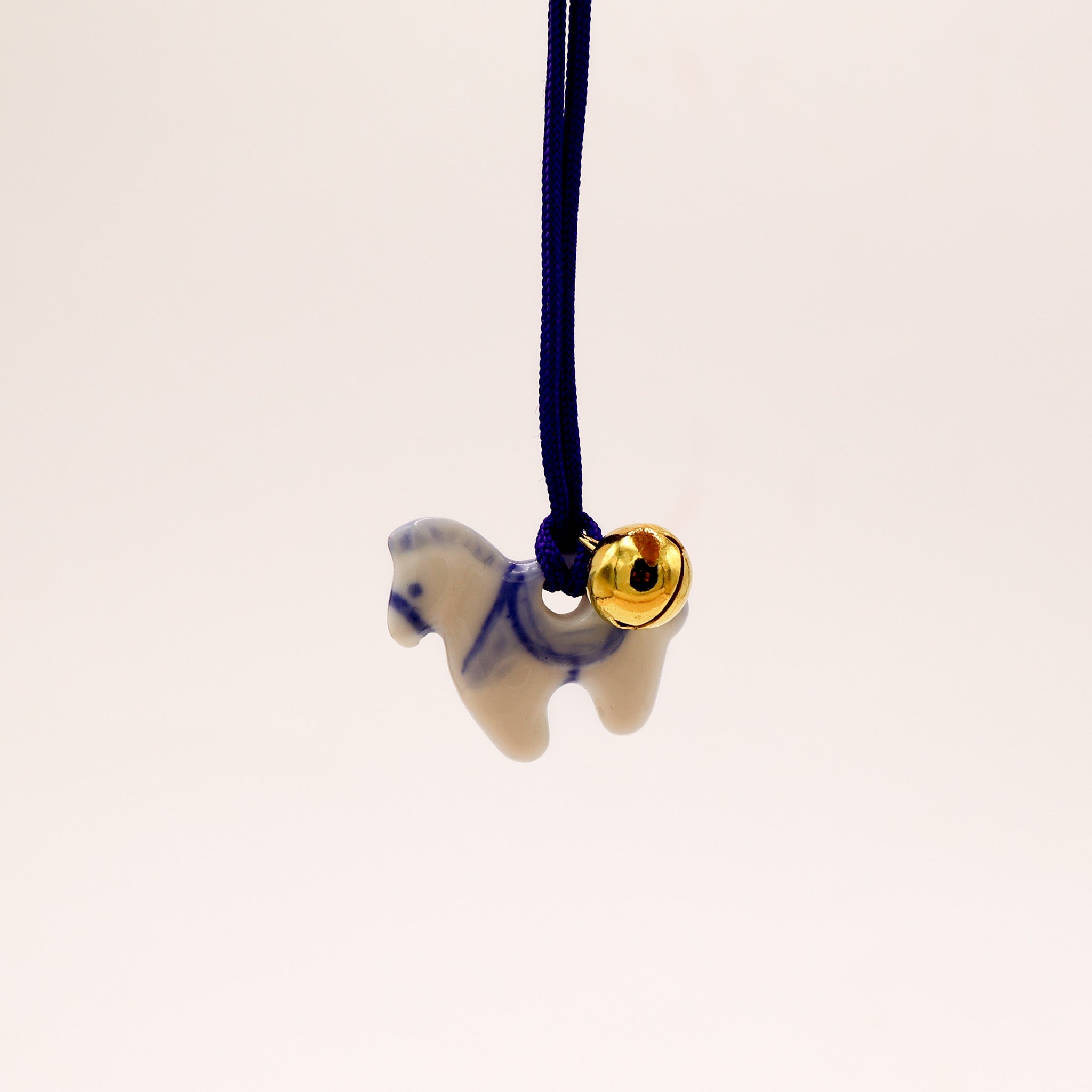 Ceramic horse pendant with bell
