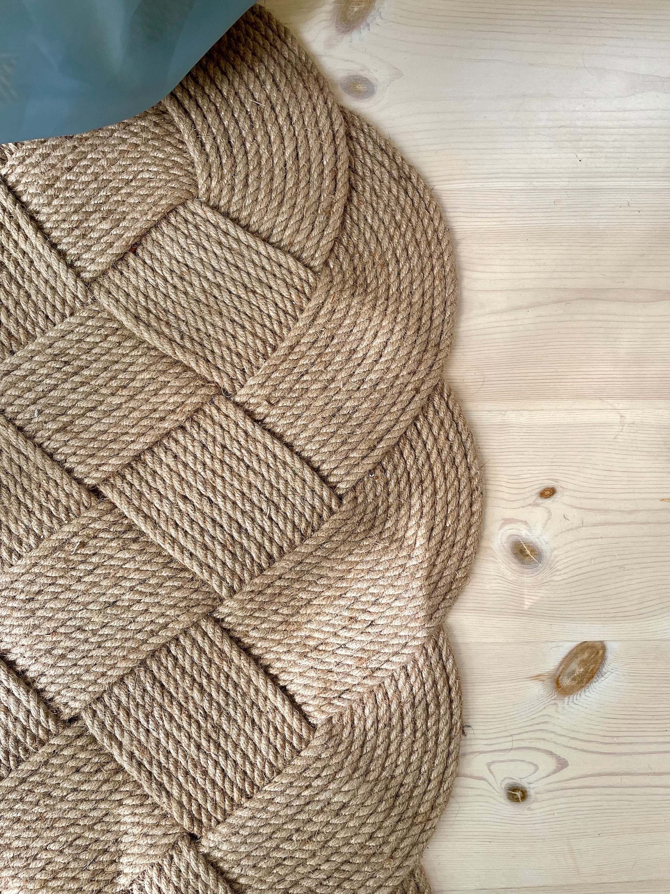 Large hand-woven door mat in jute