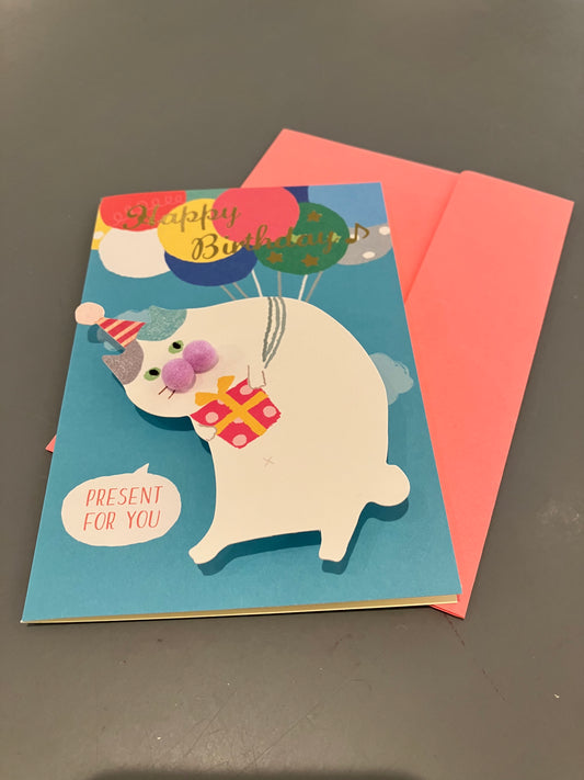 Pop-up fødselsdagskort med kat der svæver i balloner