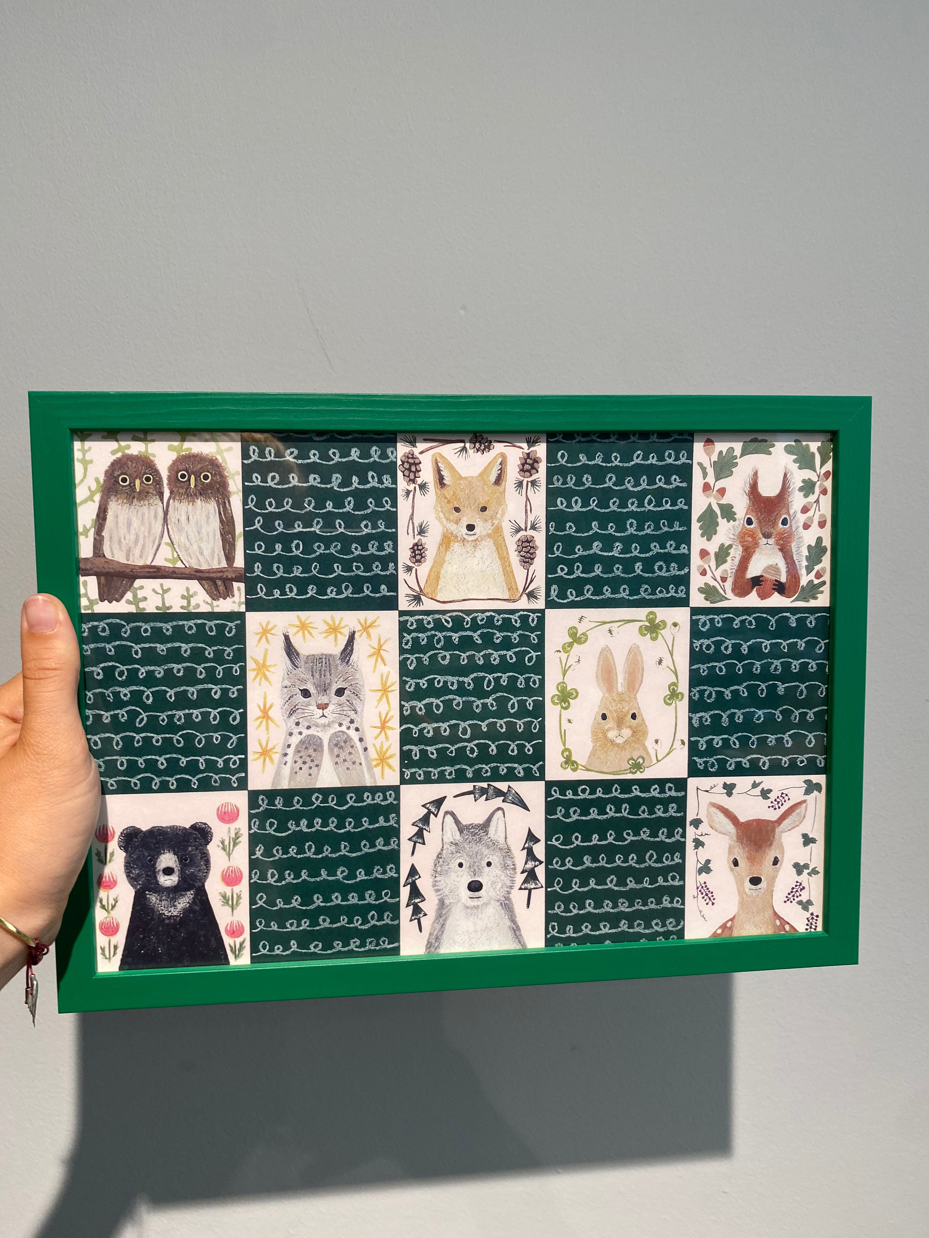Picture of forest animals in green frame
