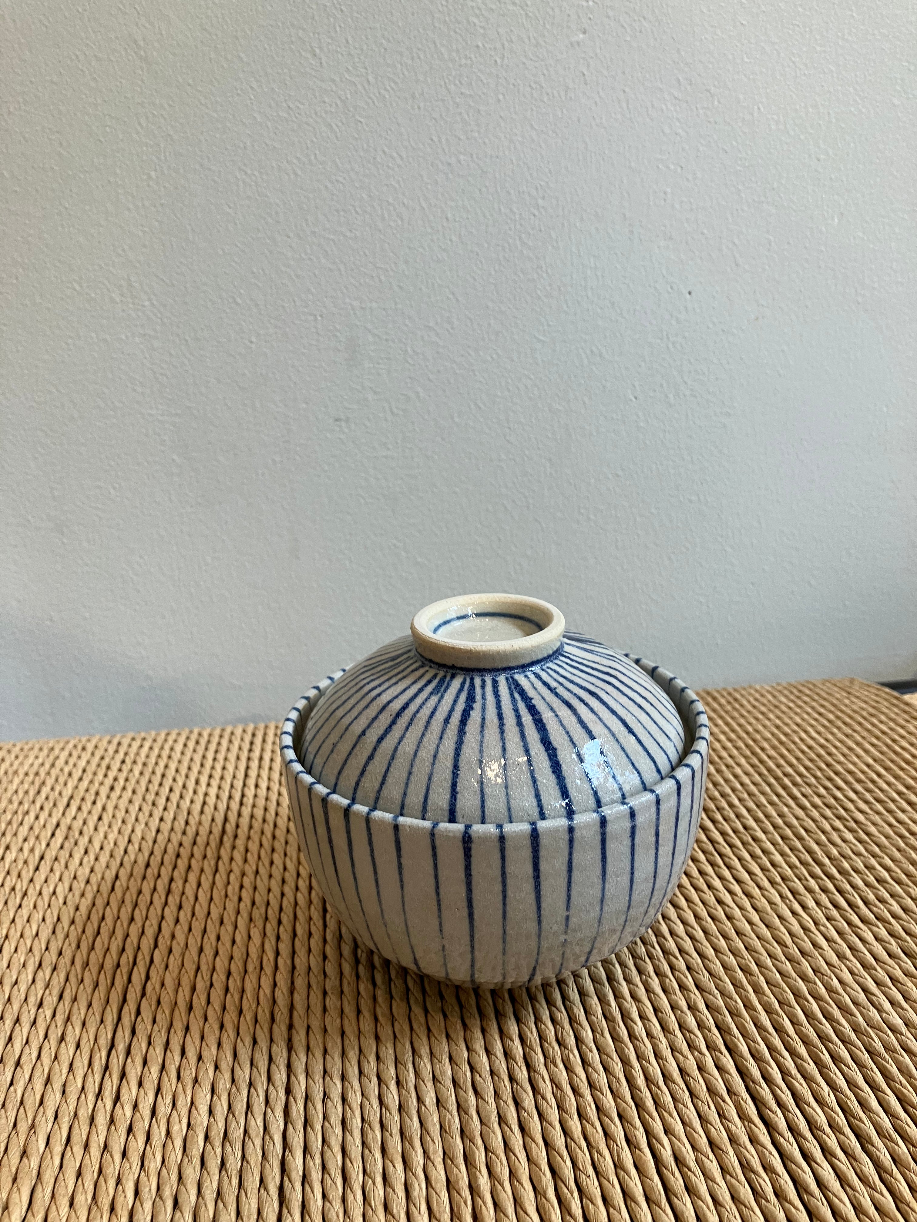 Large lidded jar with blue stripes