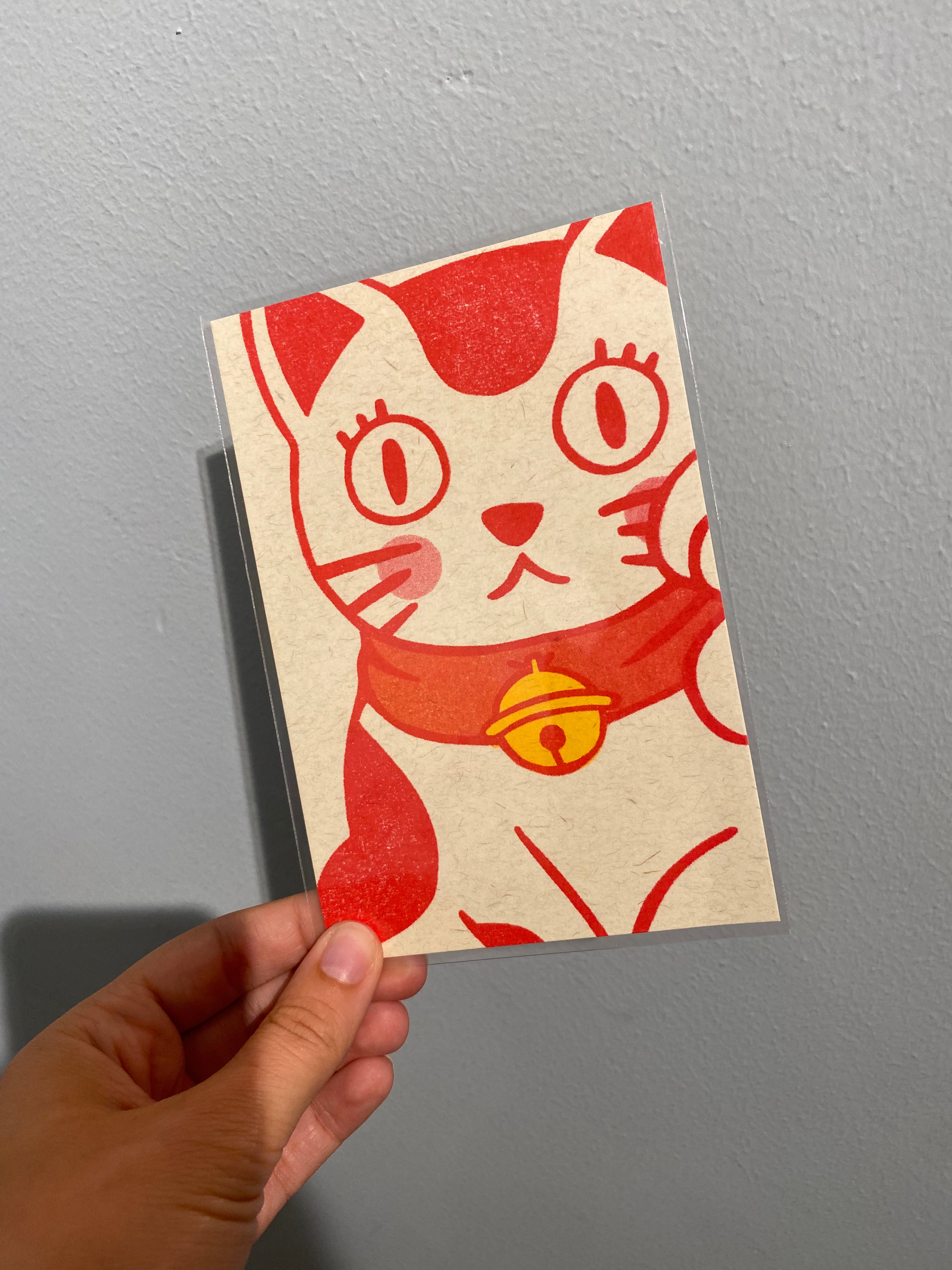 Card with red lucky cat and bell