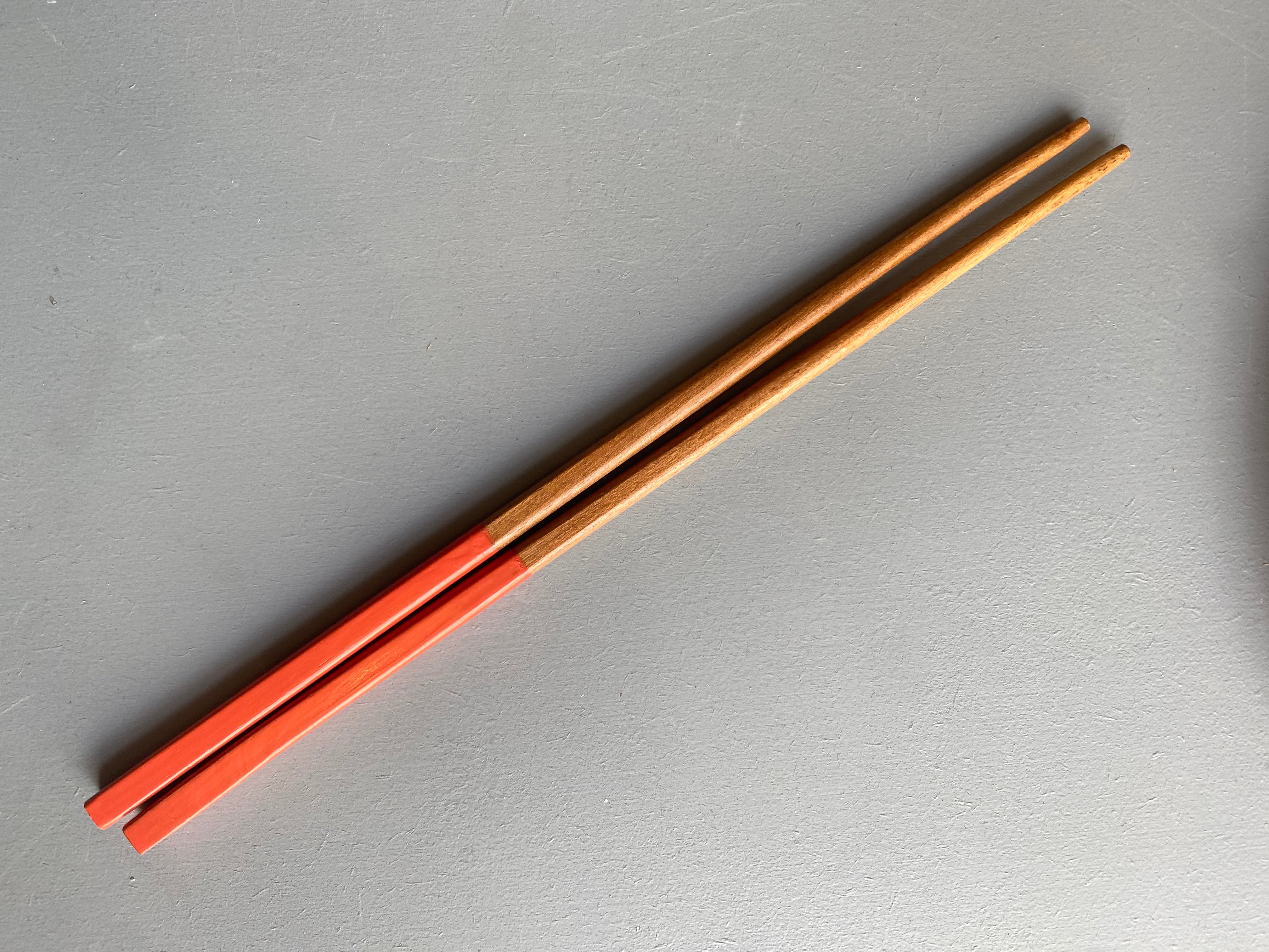 Chopsticks in dark wood