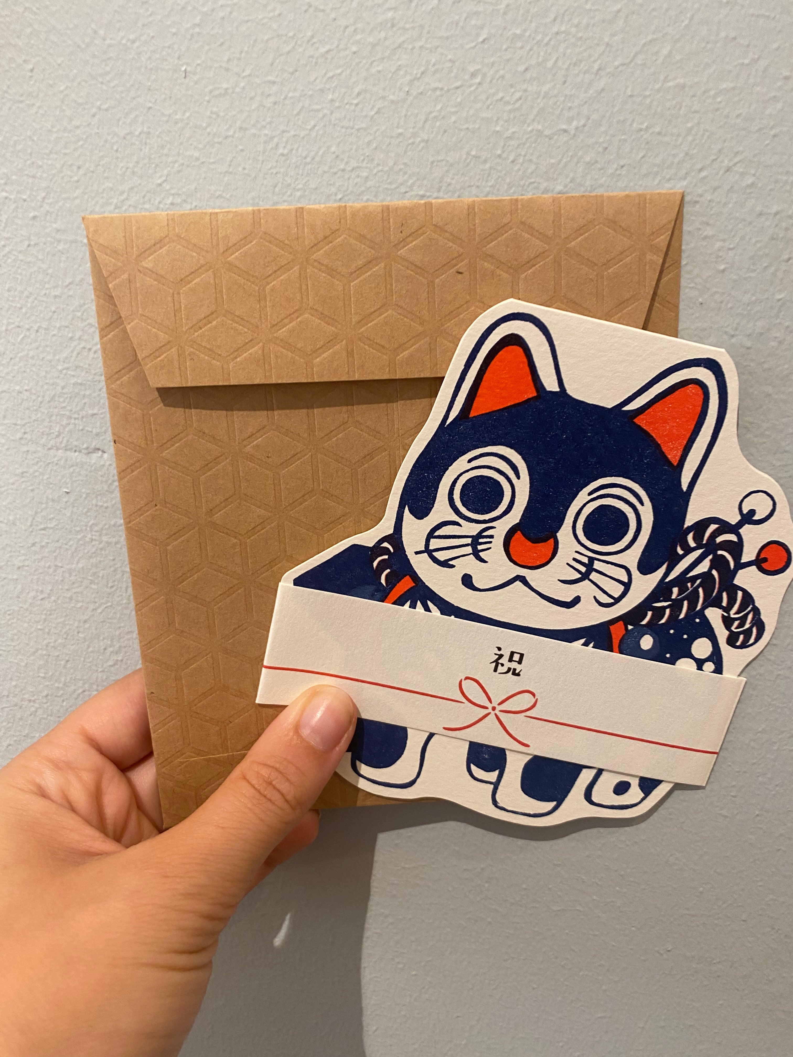 Card with blue and red dog