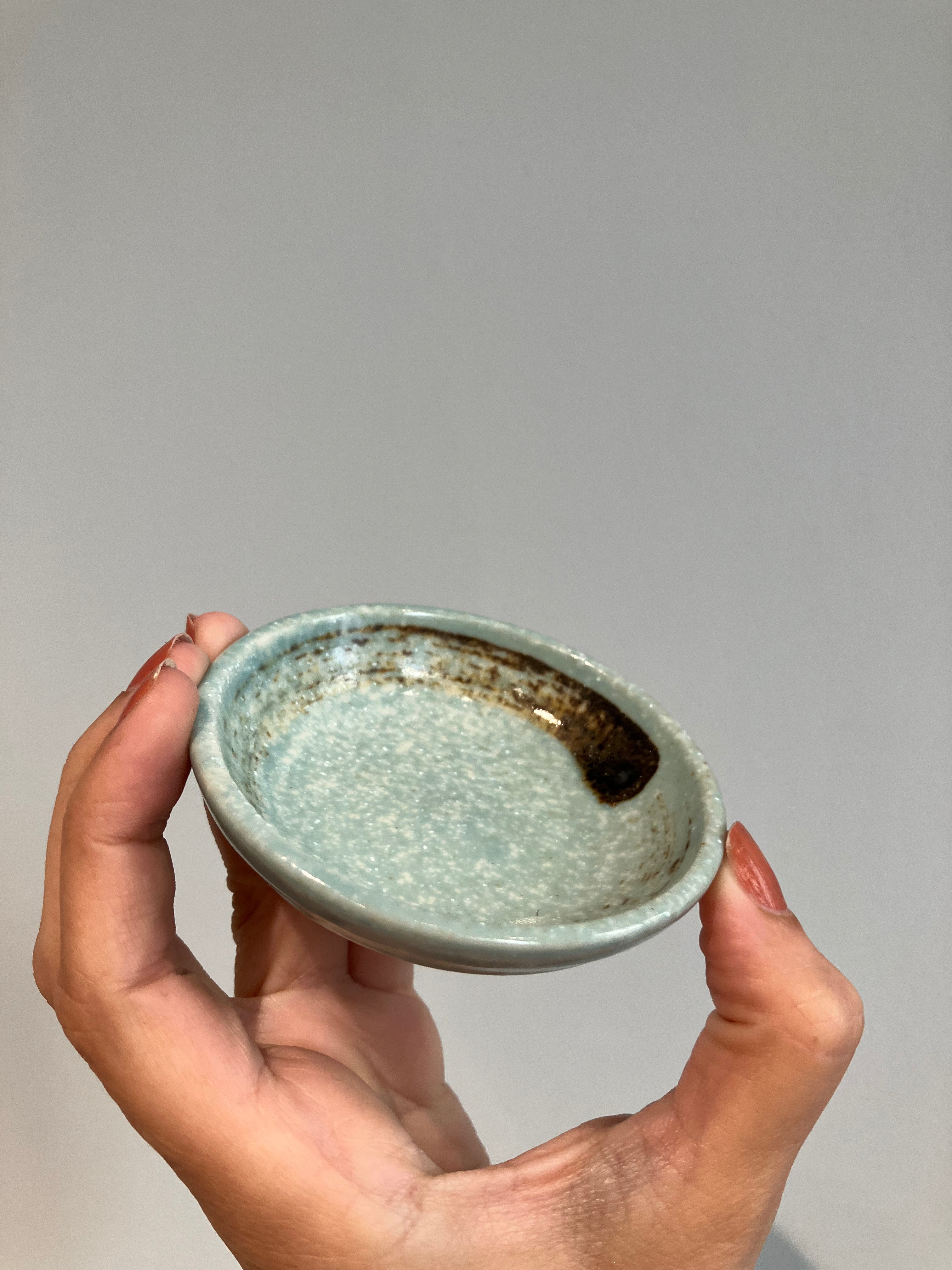 Small soy bowl with light green glaze and brown brush strokes