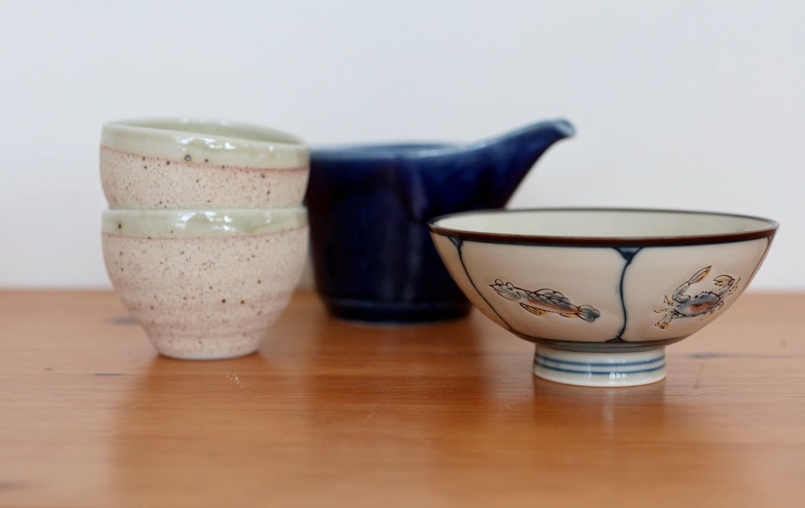 Small ceramic bowl with light green rim