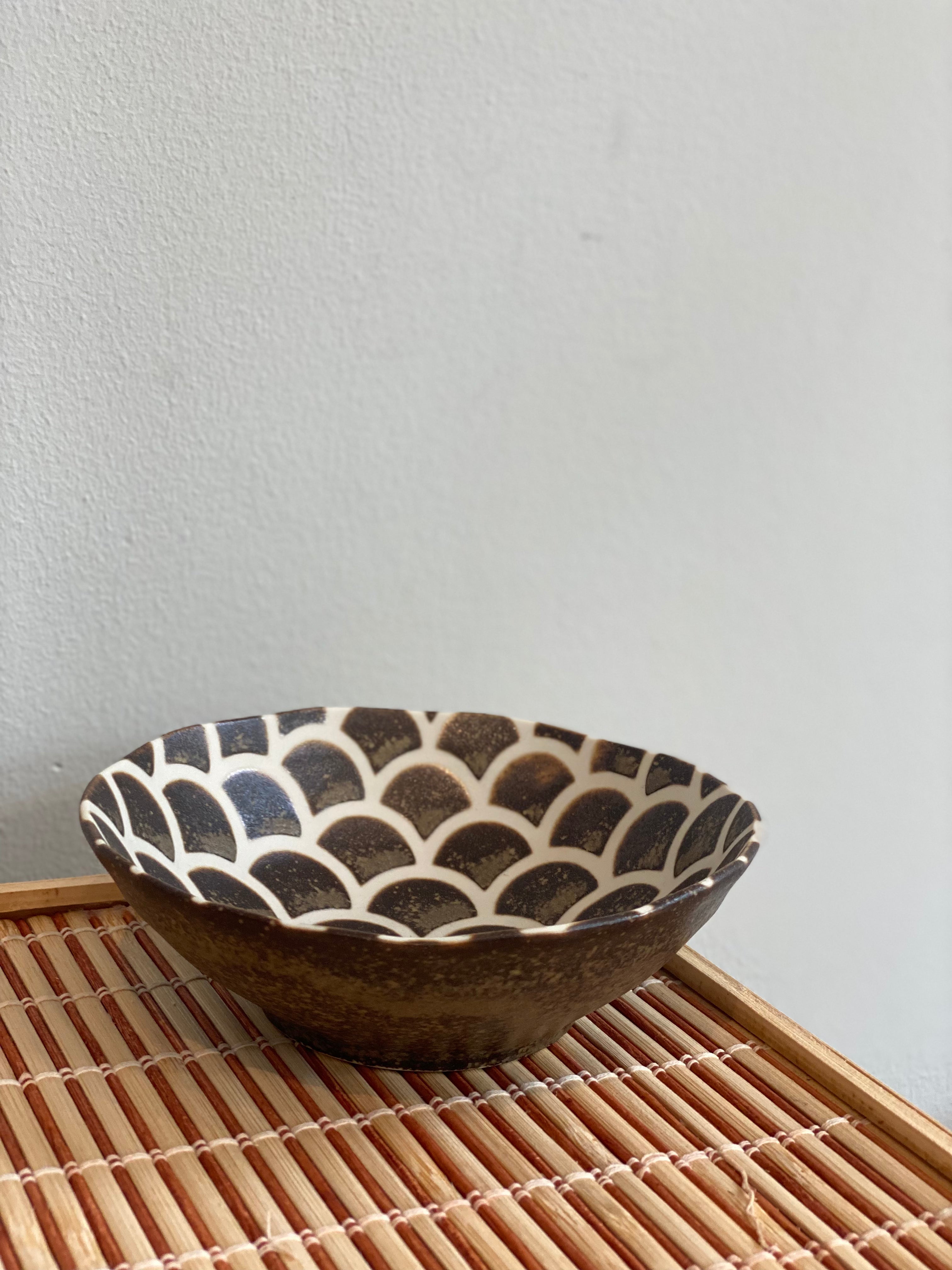 Small brown bowl with fish scales