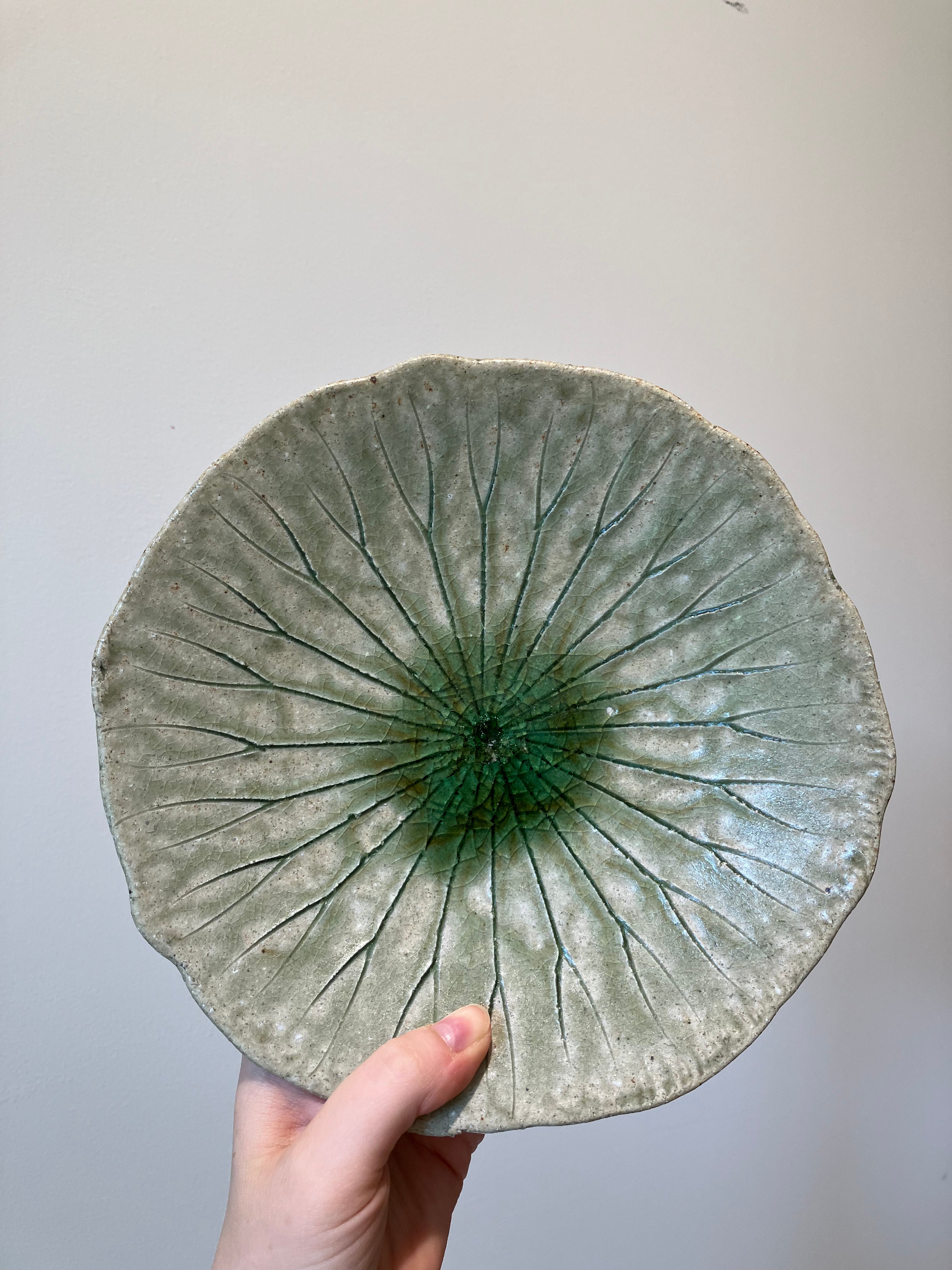 Small round dish with green leaf pattern