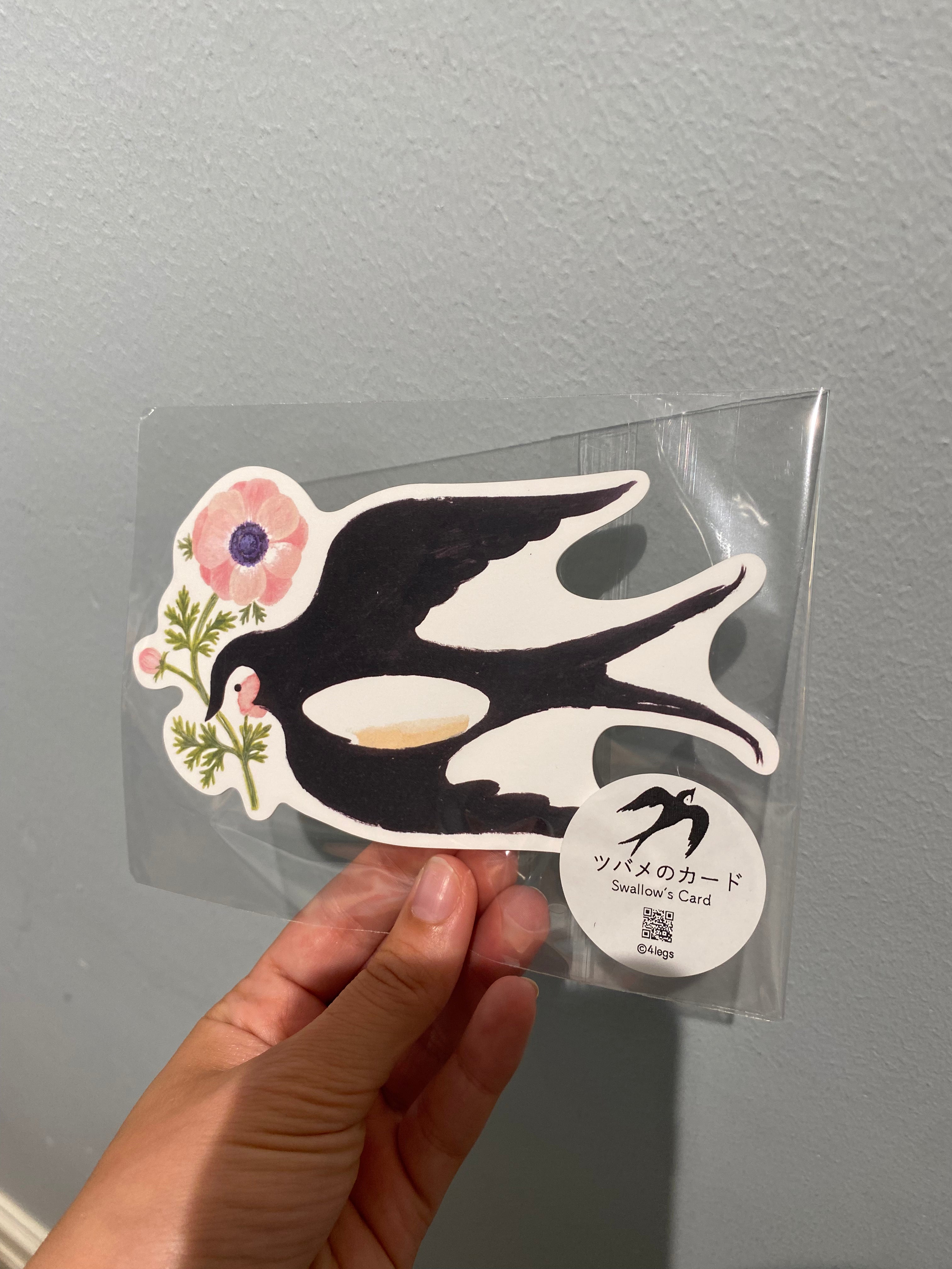 Card with large swallow and flower