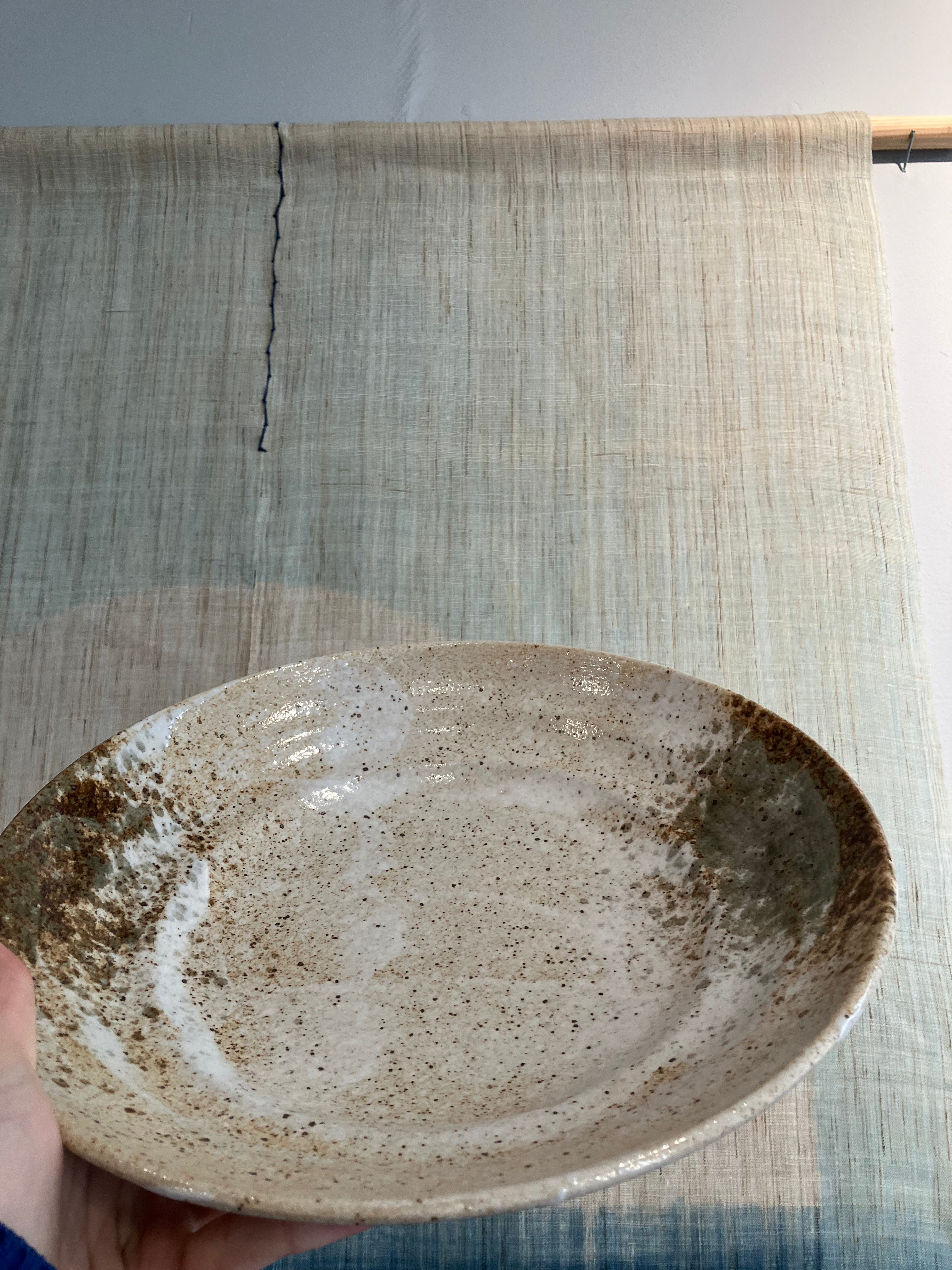Large dish with rustic glaze in shades of brown and green