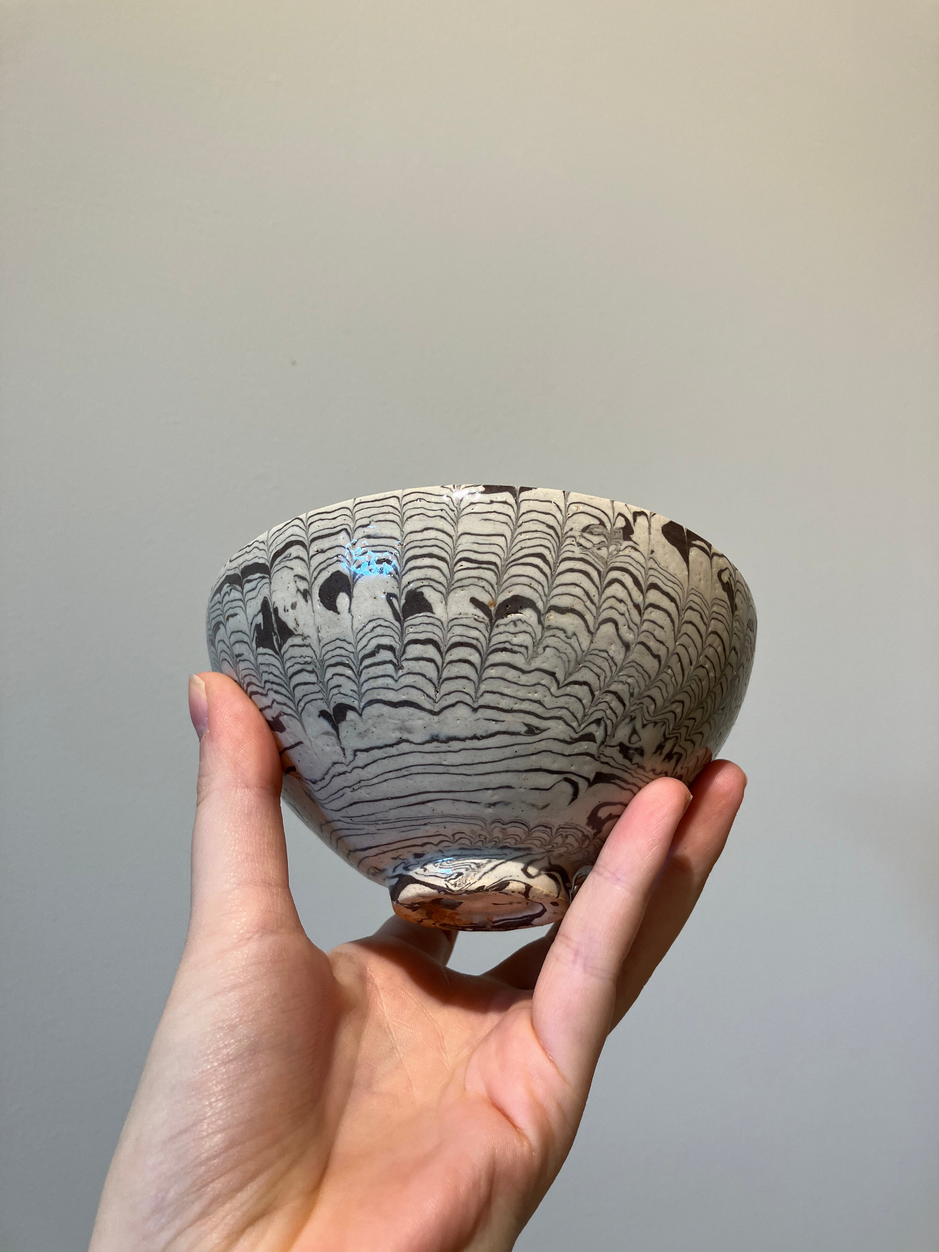 Handmade bowl in brown and beige clay