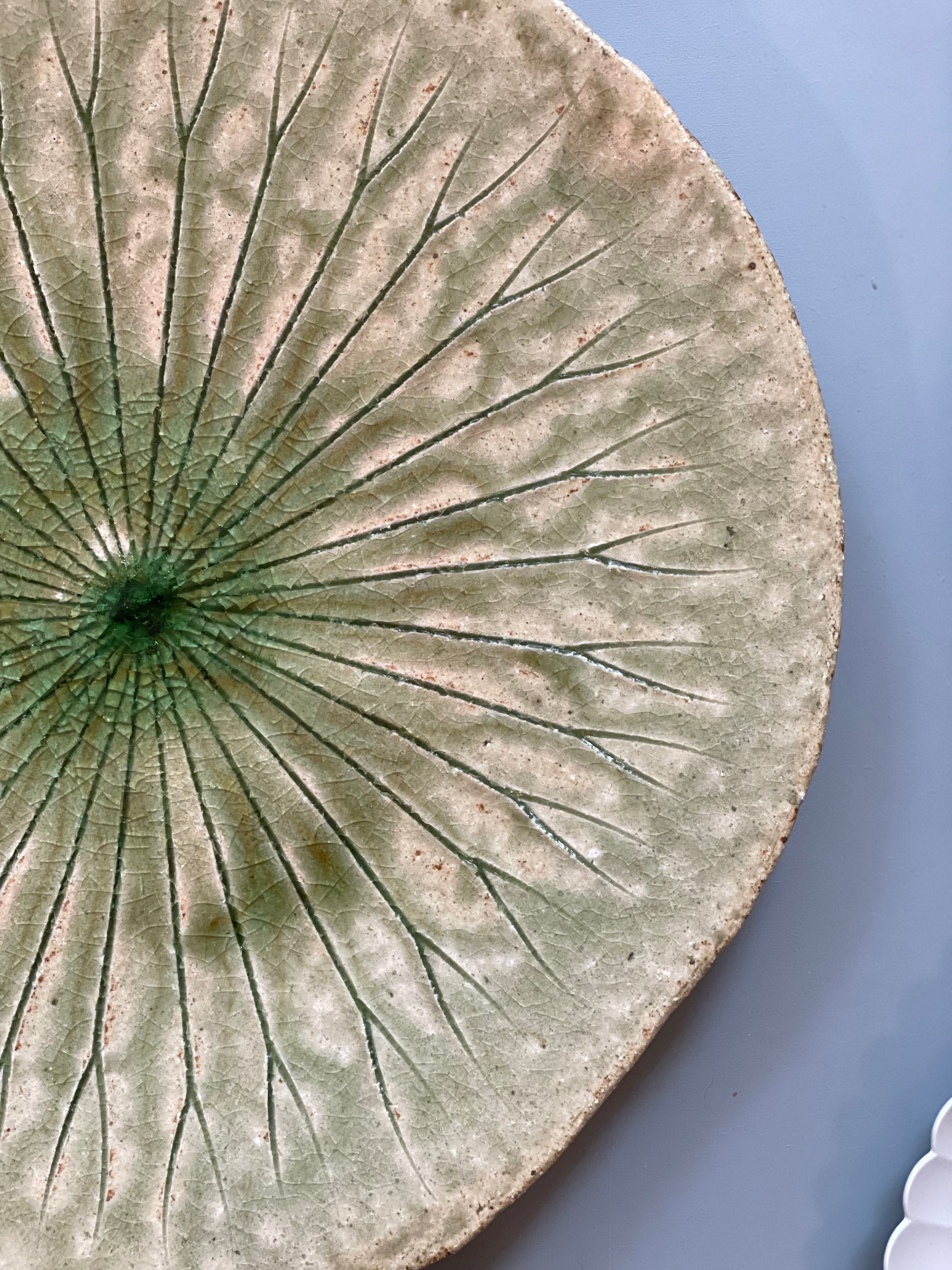 Large round dish with green leaf pattern