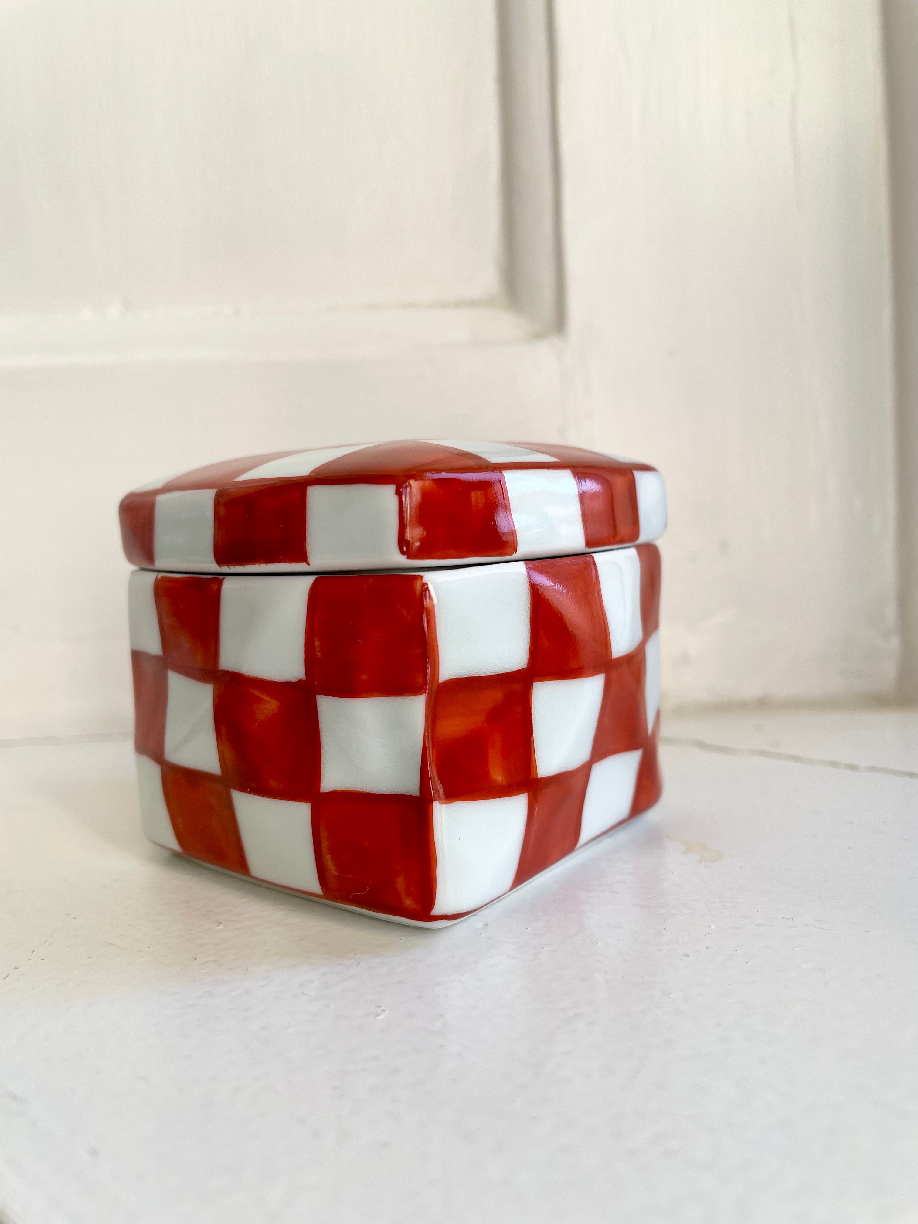Handmade lidded jar with red/white checkered glaze