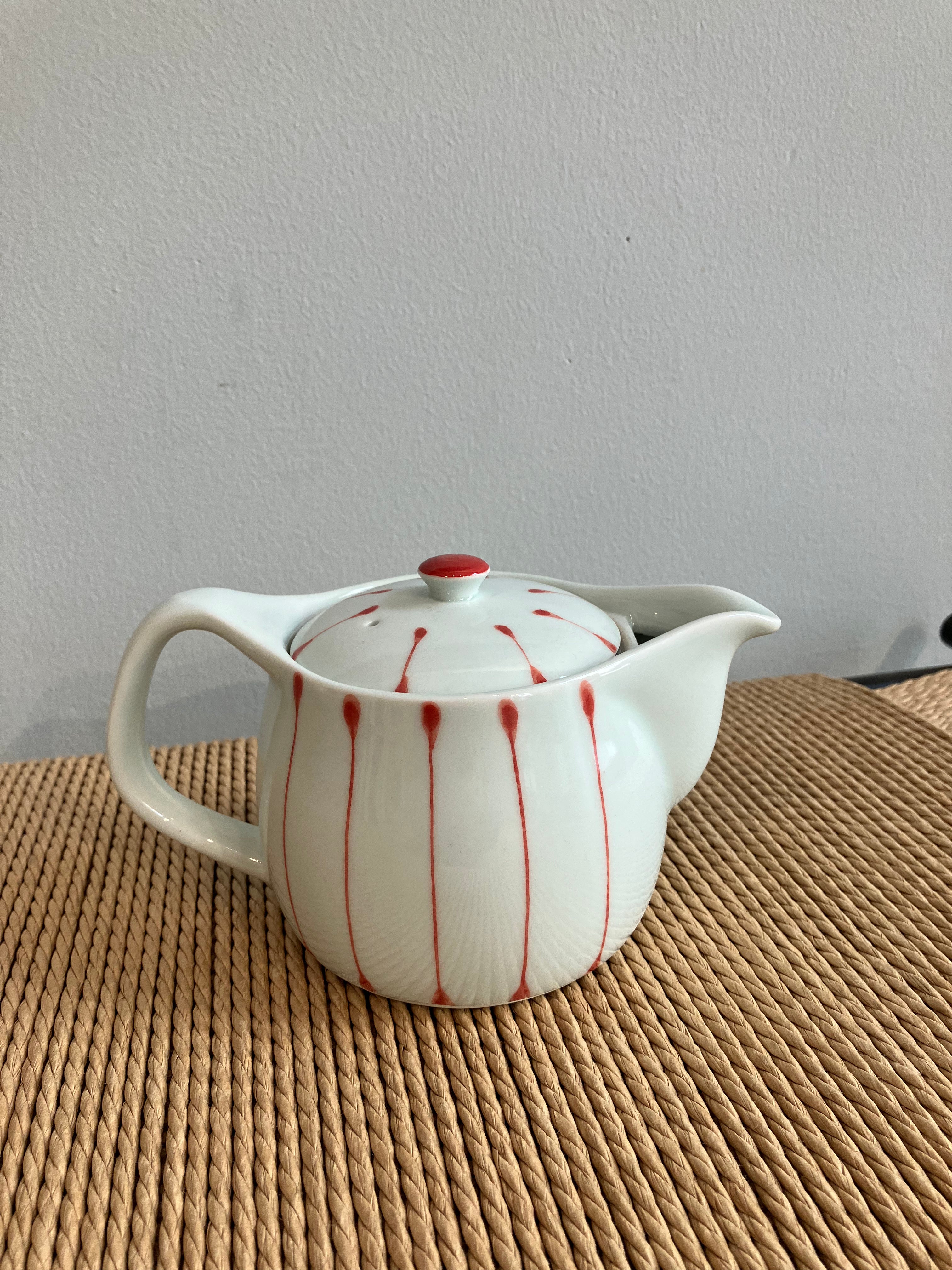 Small teapot with white glaze and red stripes