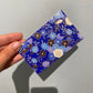 Lille blå notesblok med blomster
