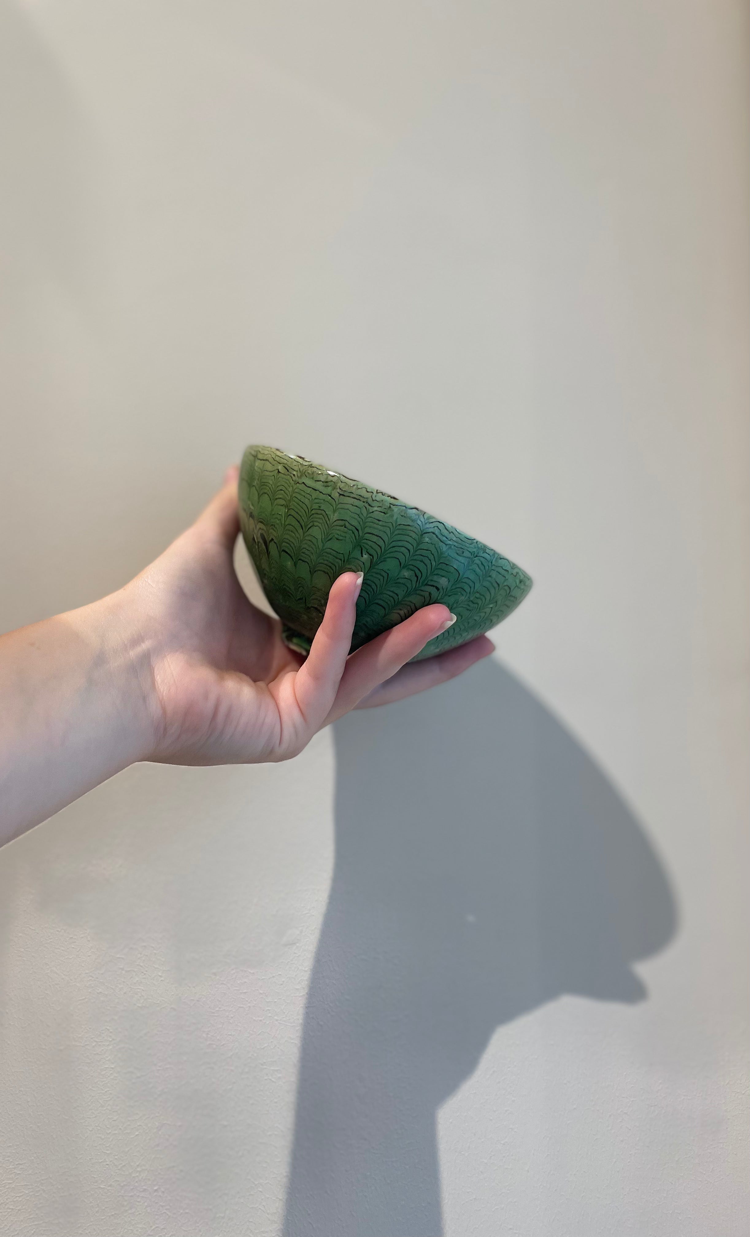 Handmade bowl in brown and green clay