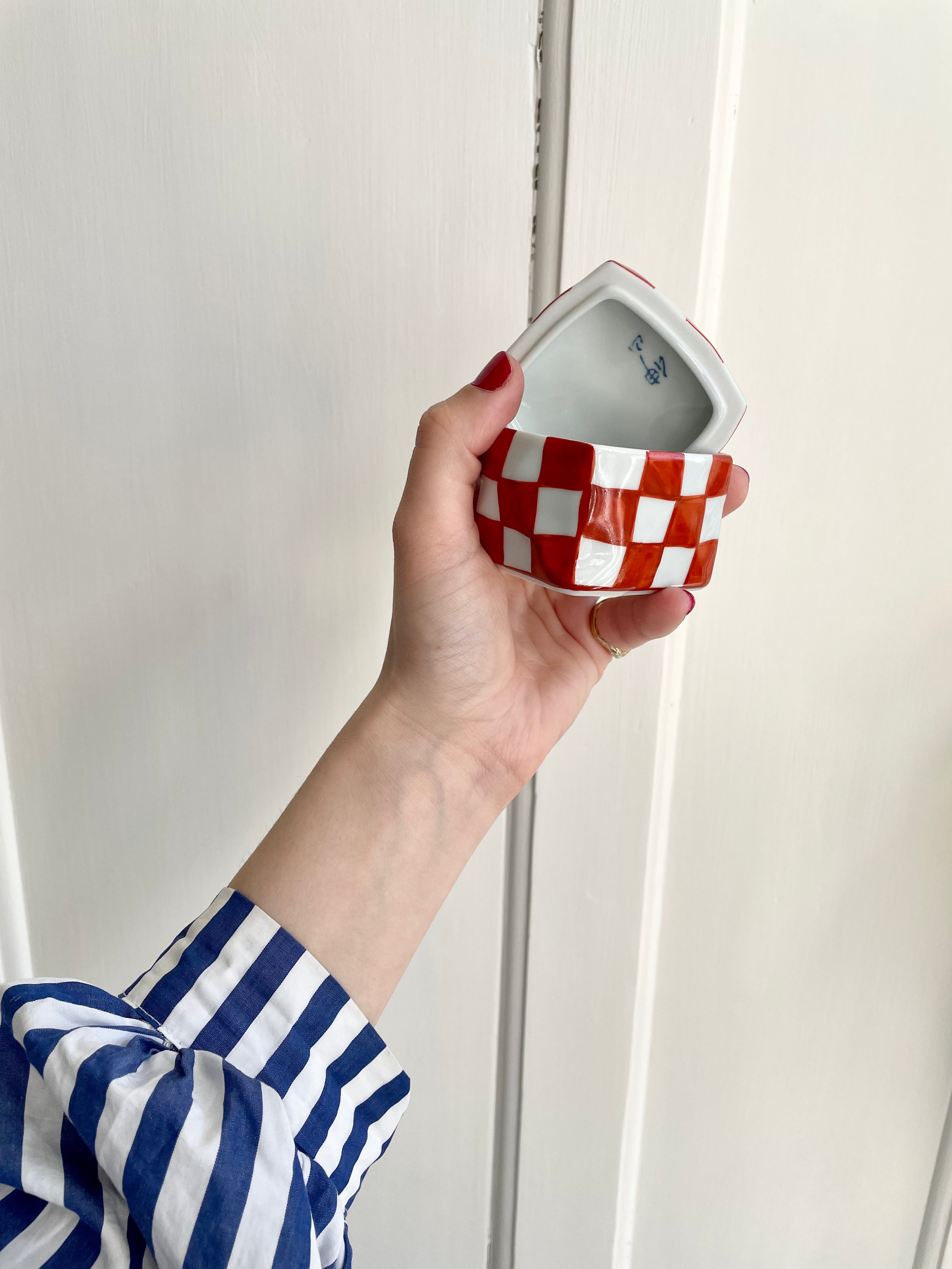 Handmade lidded jar with red/white checkered glaze