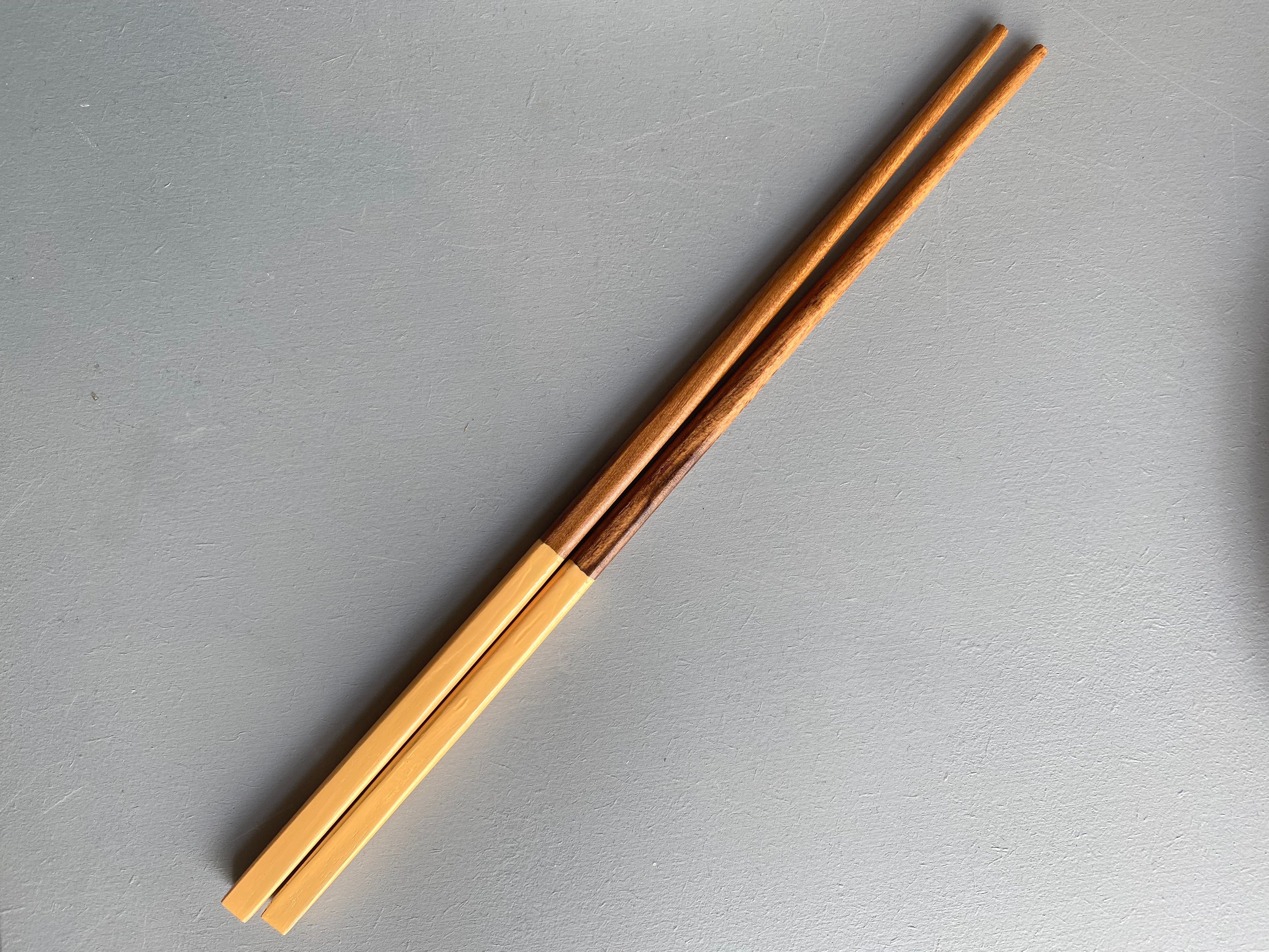 Chopsticks in dark wood