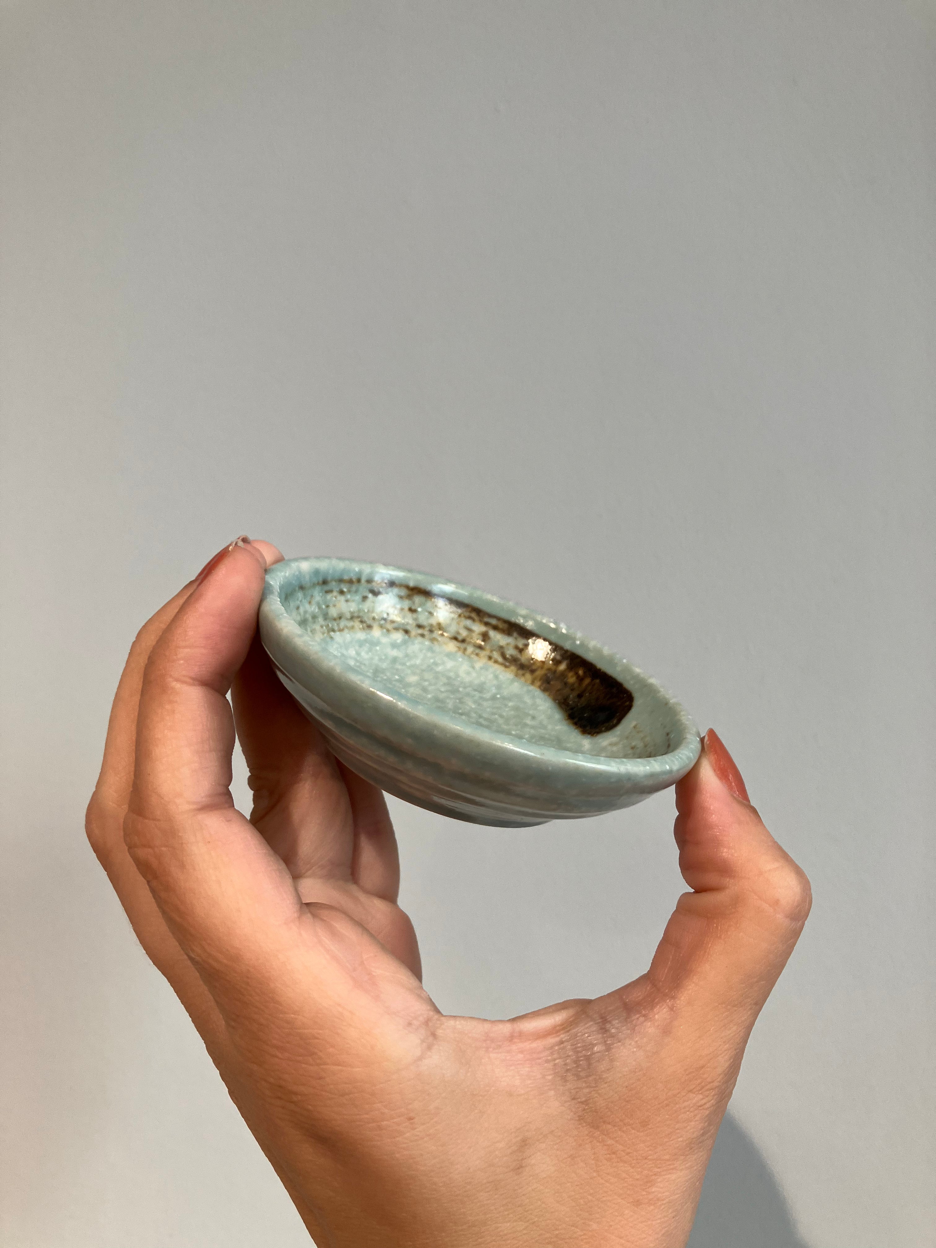 Small soy bowl with light green glaze and brown brush strokes
