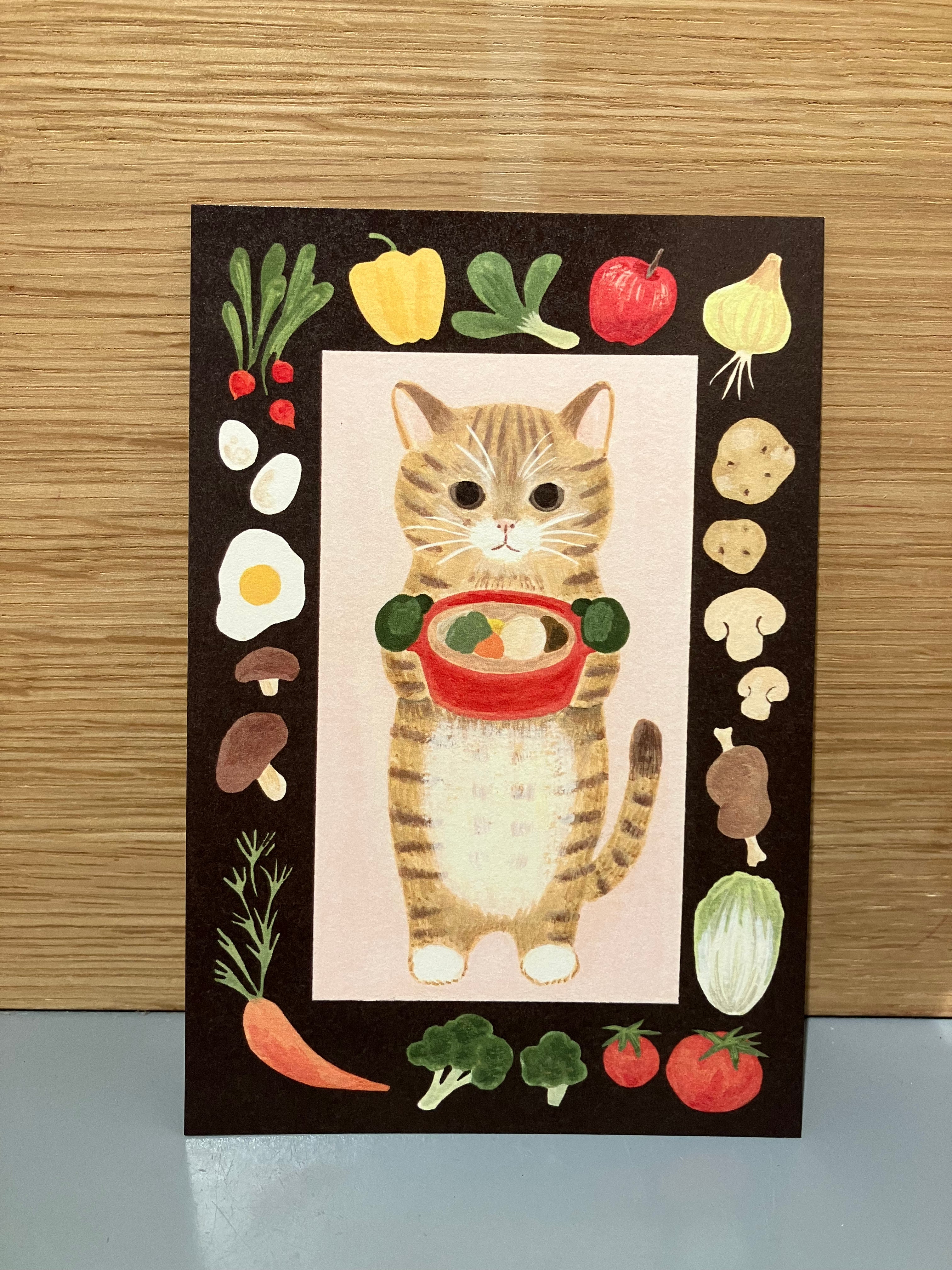 Japanese card with cat holding a pot of food