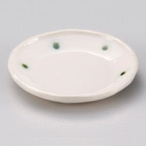 Small white bowl with green dots