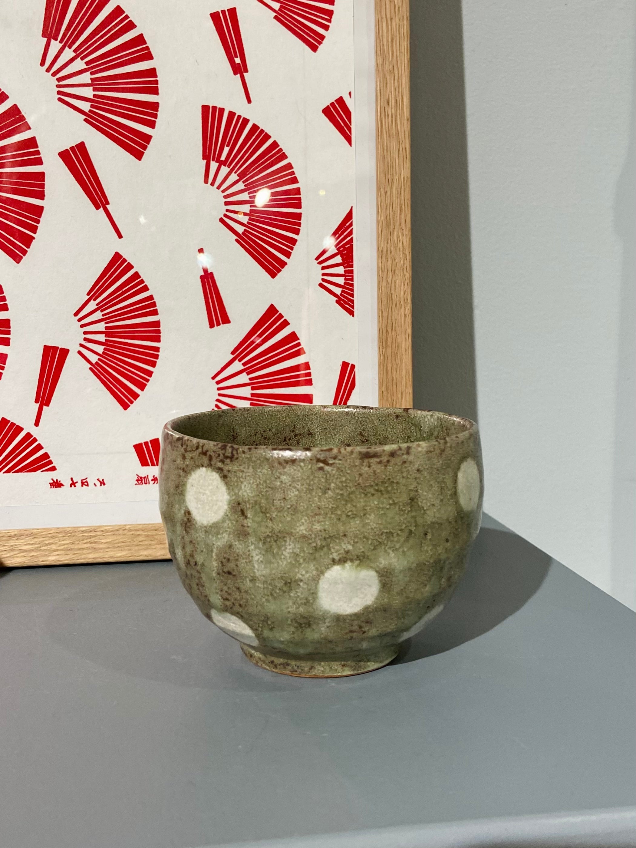 Ceramic cup with white dots