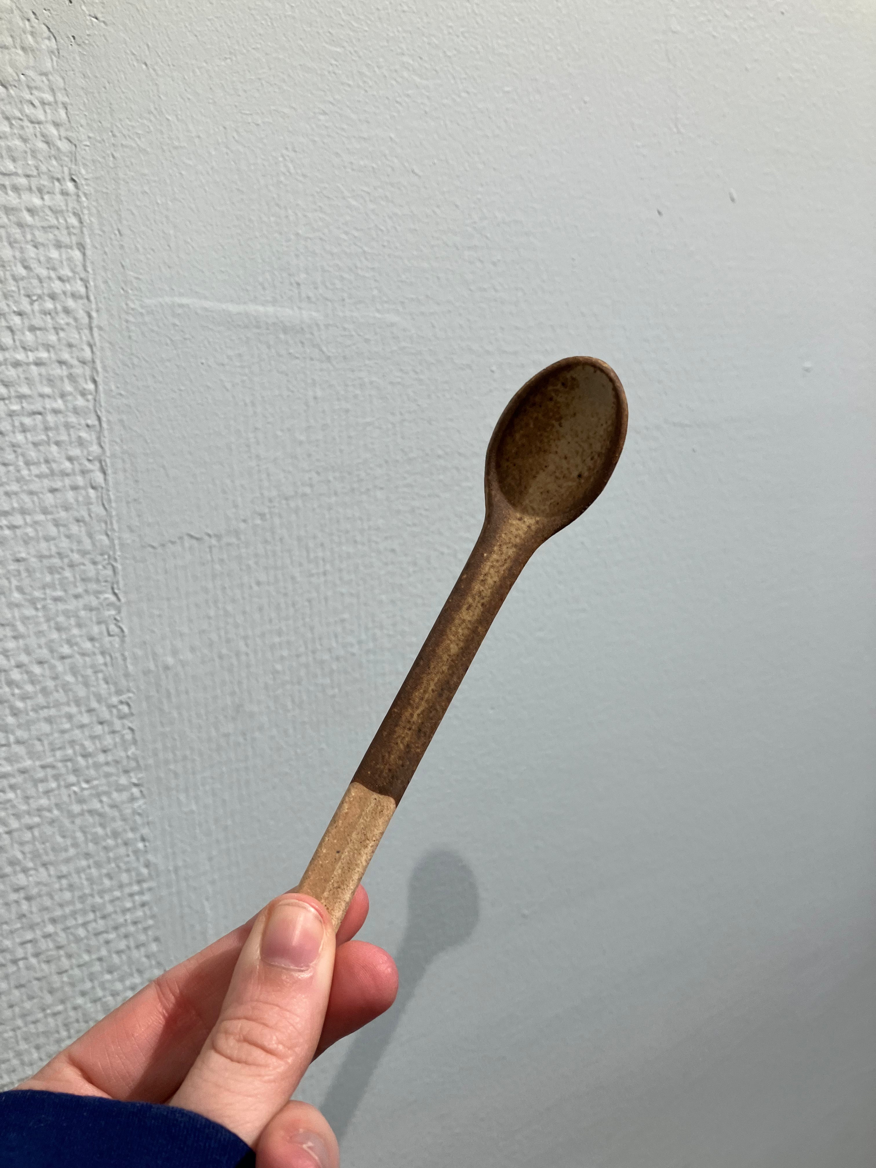 Rustic ceramic spoon with brown glaze