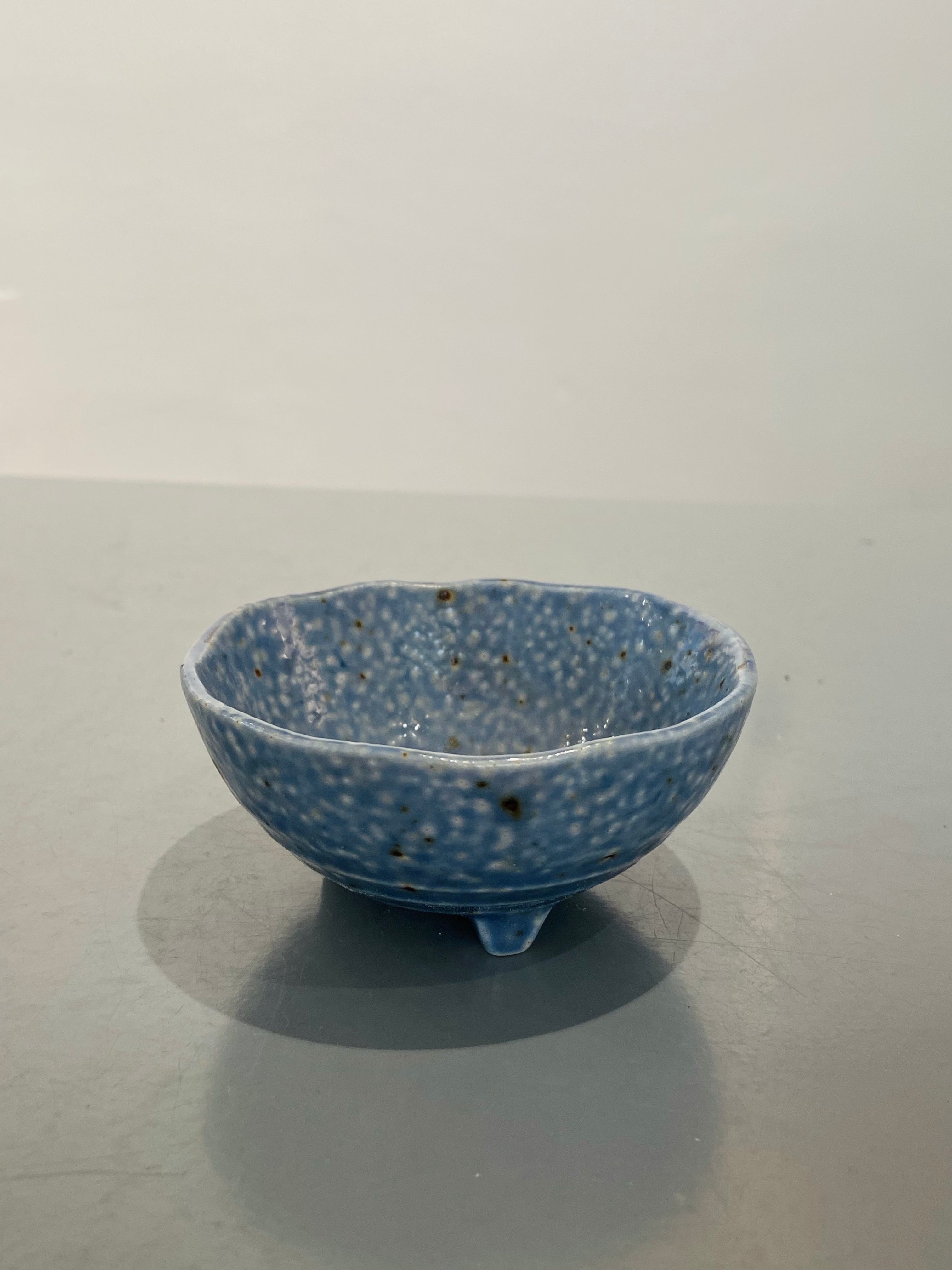 Light blue bowl with three feet
