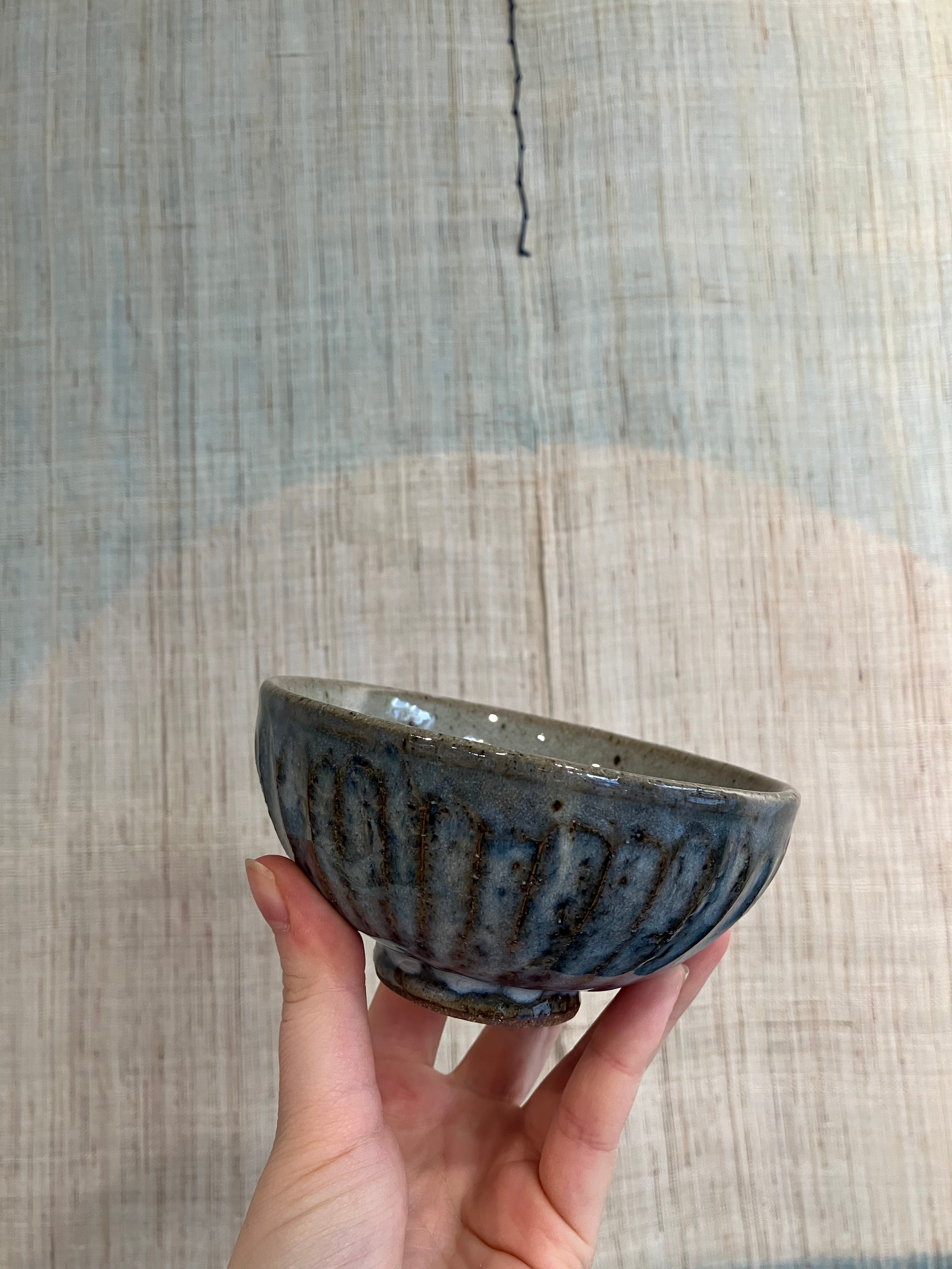Structure bowl with blue glaze and brown details