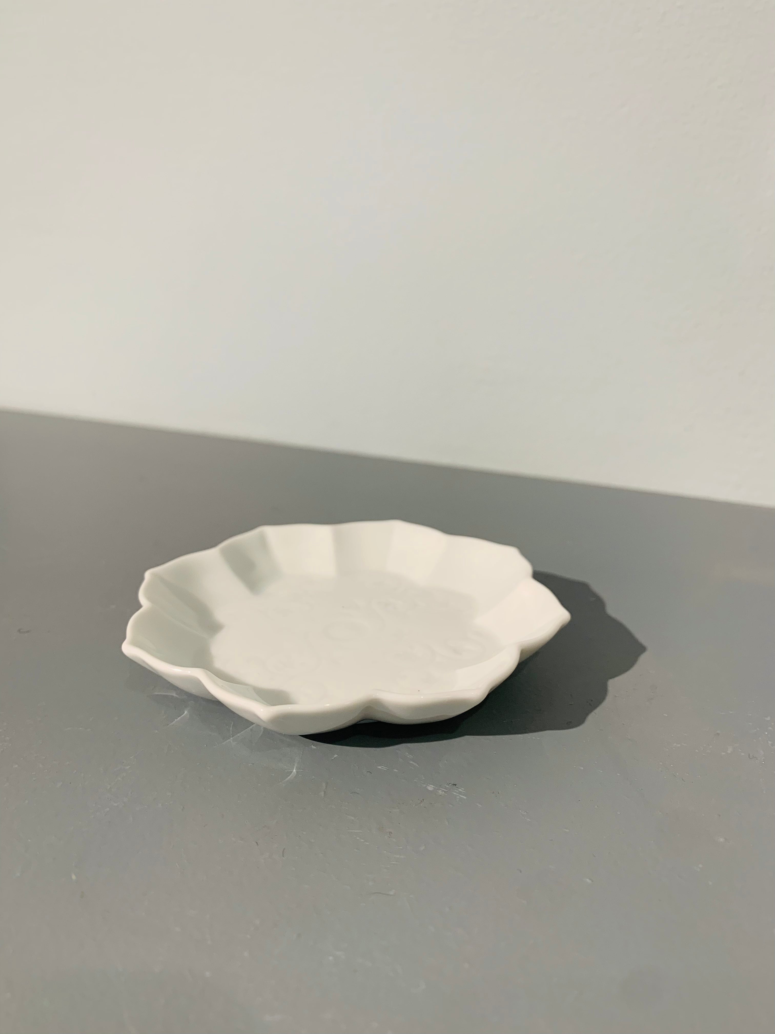 Small white bowl with floral motif