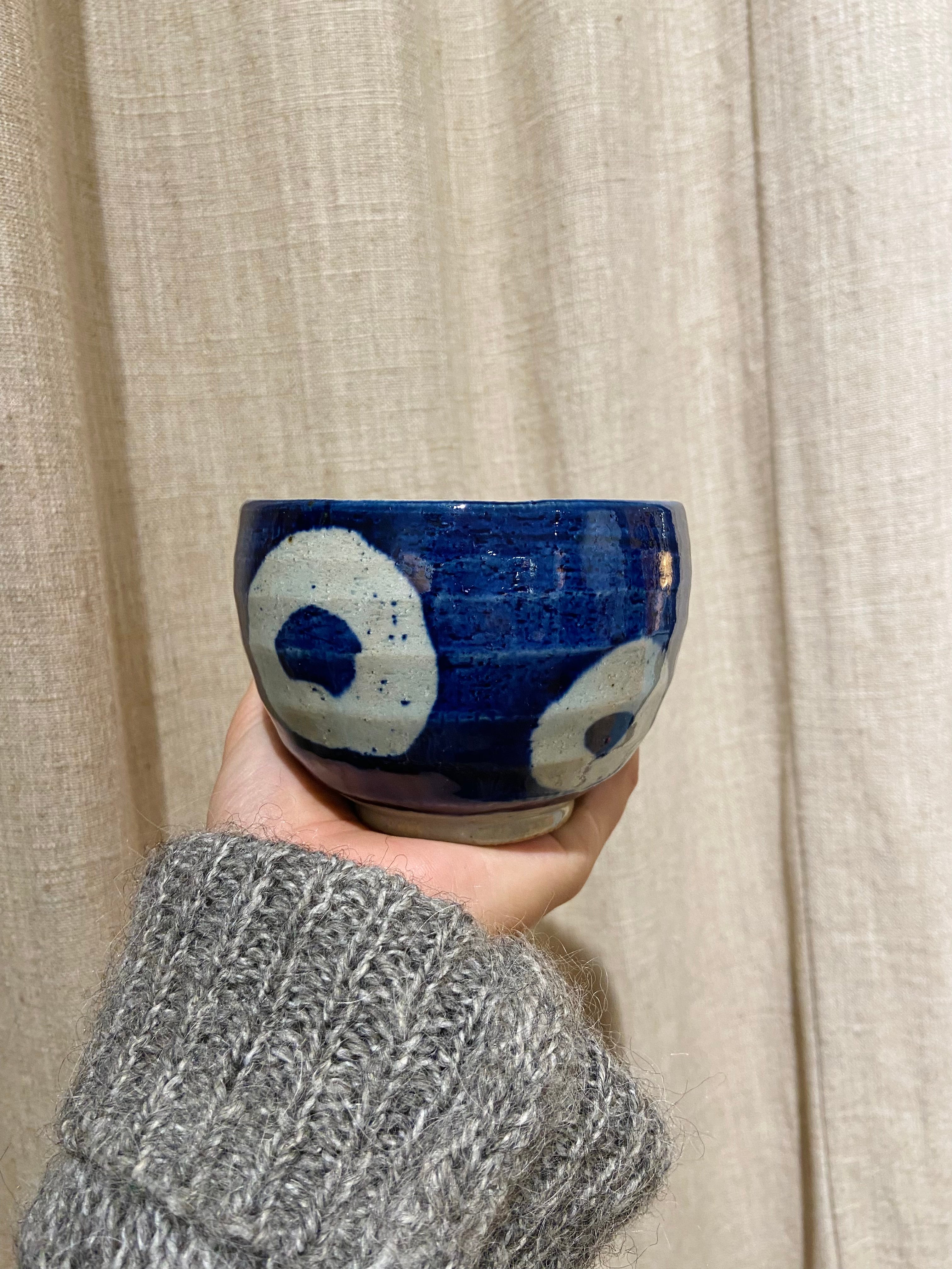 Blue ceramic cup with white rings