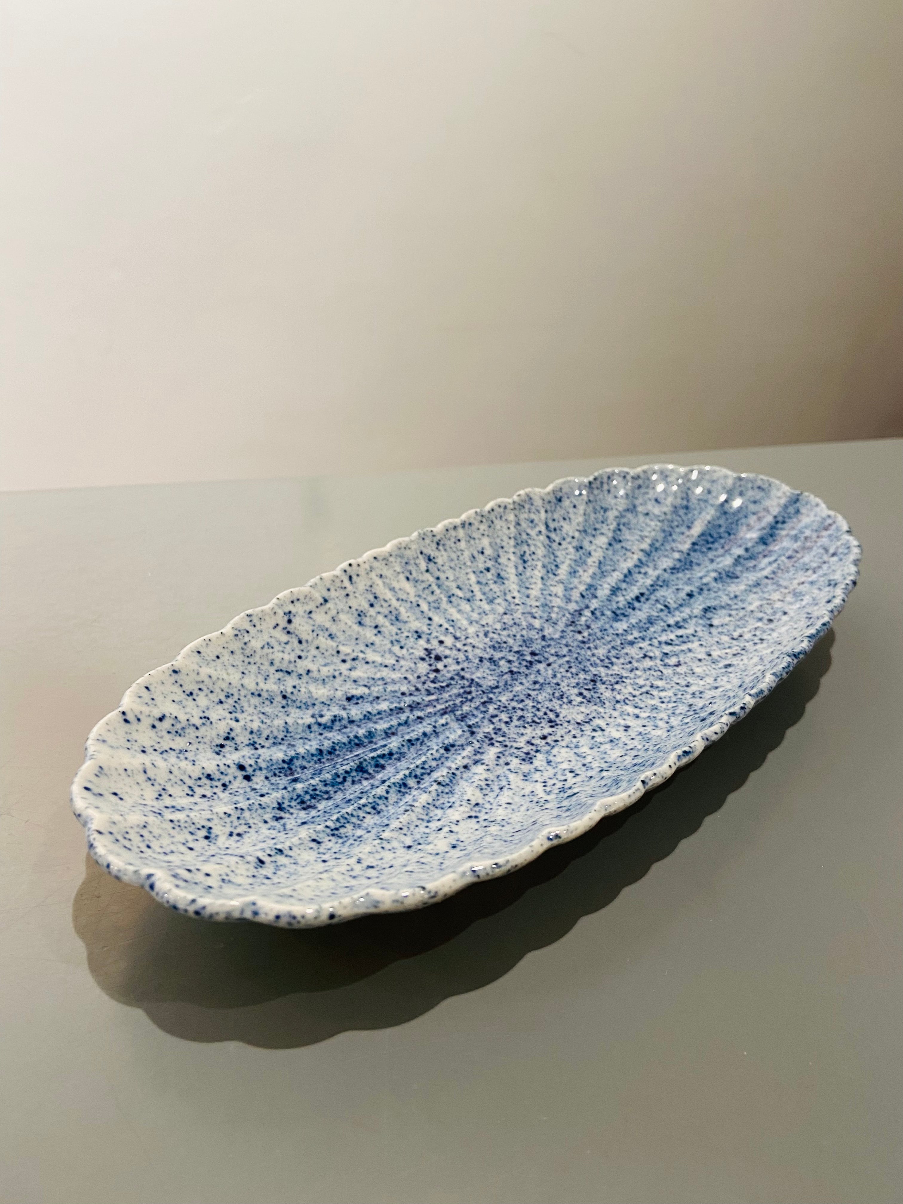 Oval flower dish with blue splash