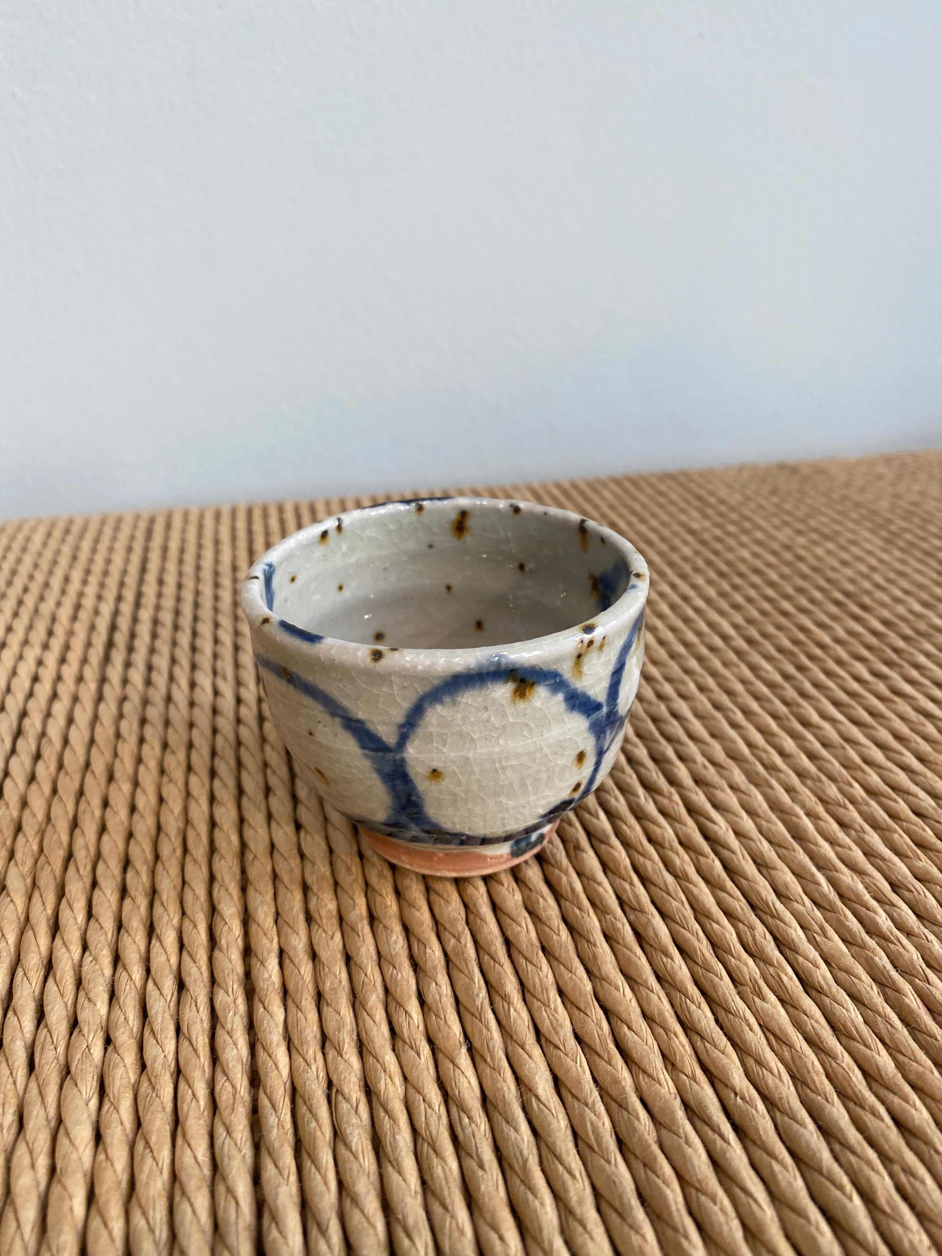 Sake cup with white glaze and blue spiral pattern