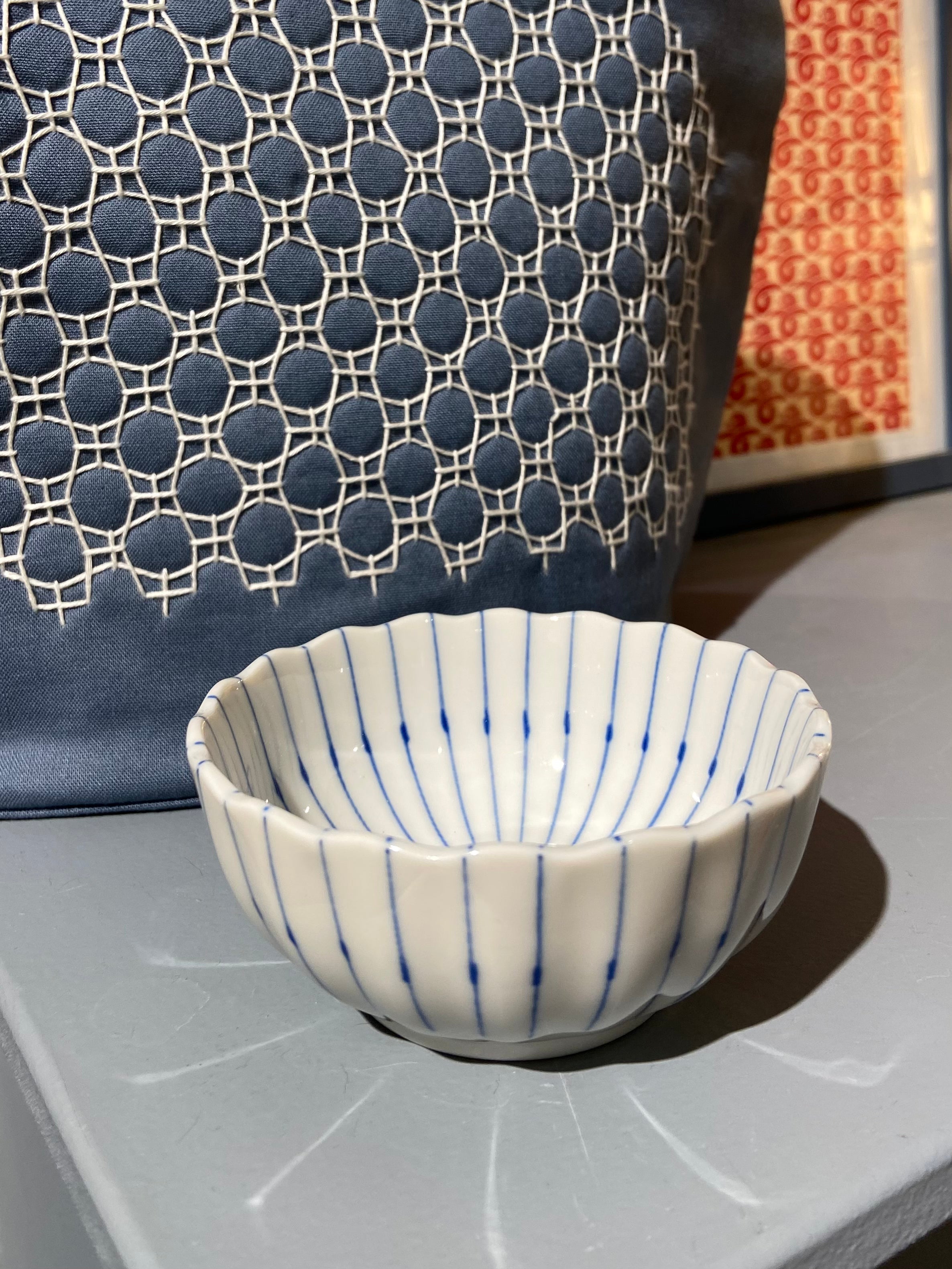 Small white bowl with blue stripes