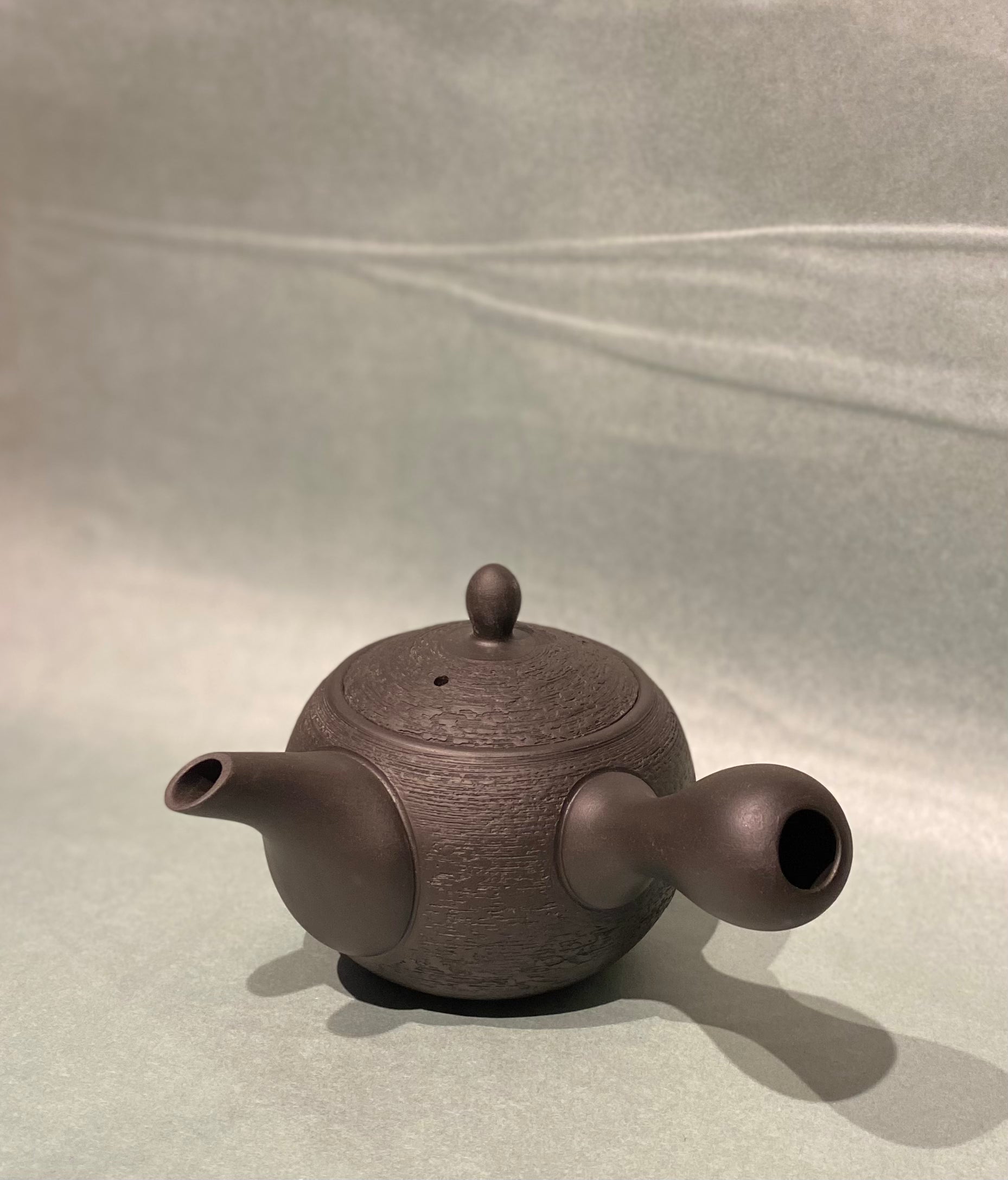 Small rustic dark brown teapot