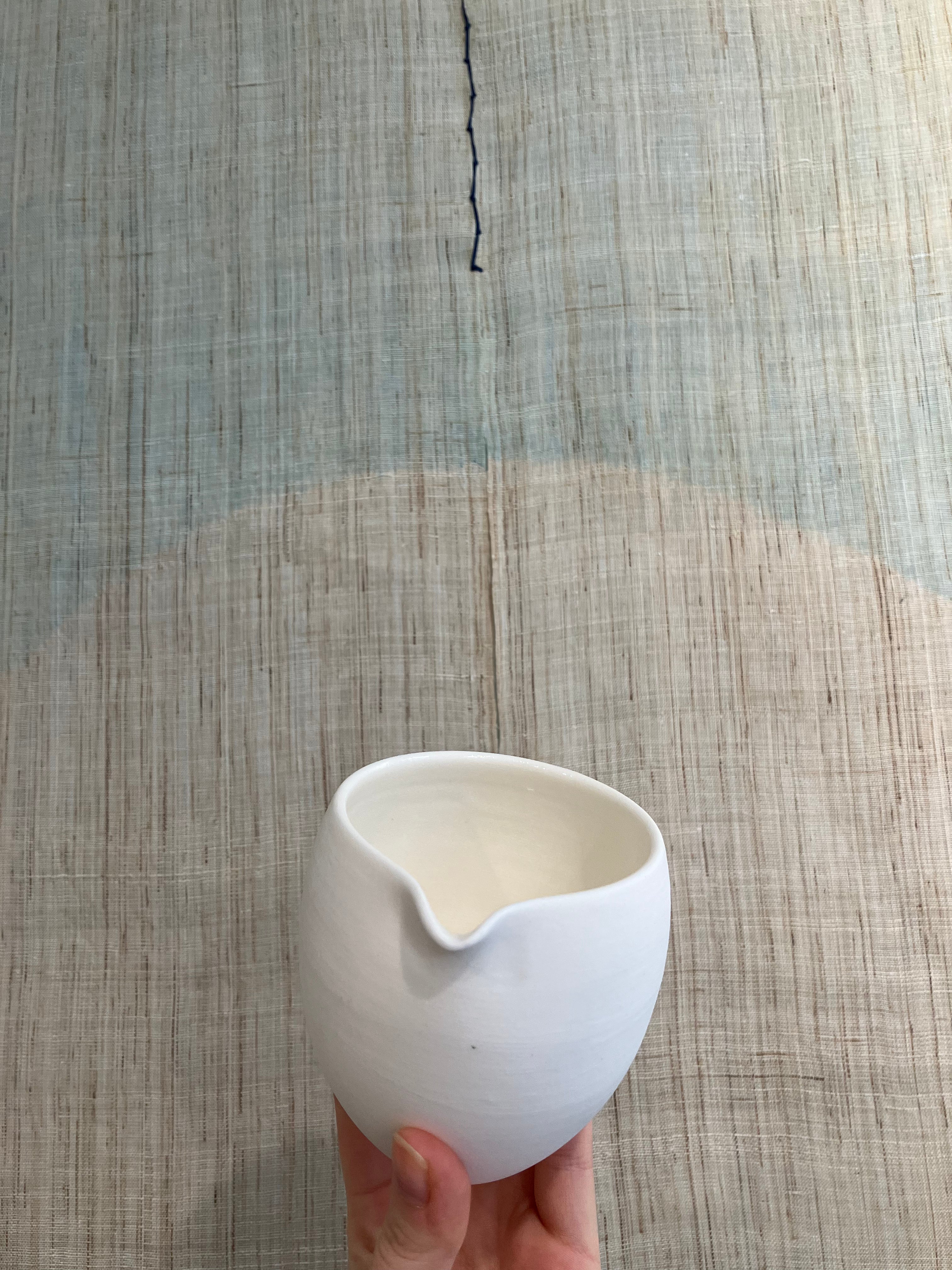 Handmade, white ceramic jug in matt glaze