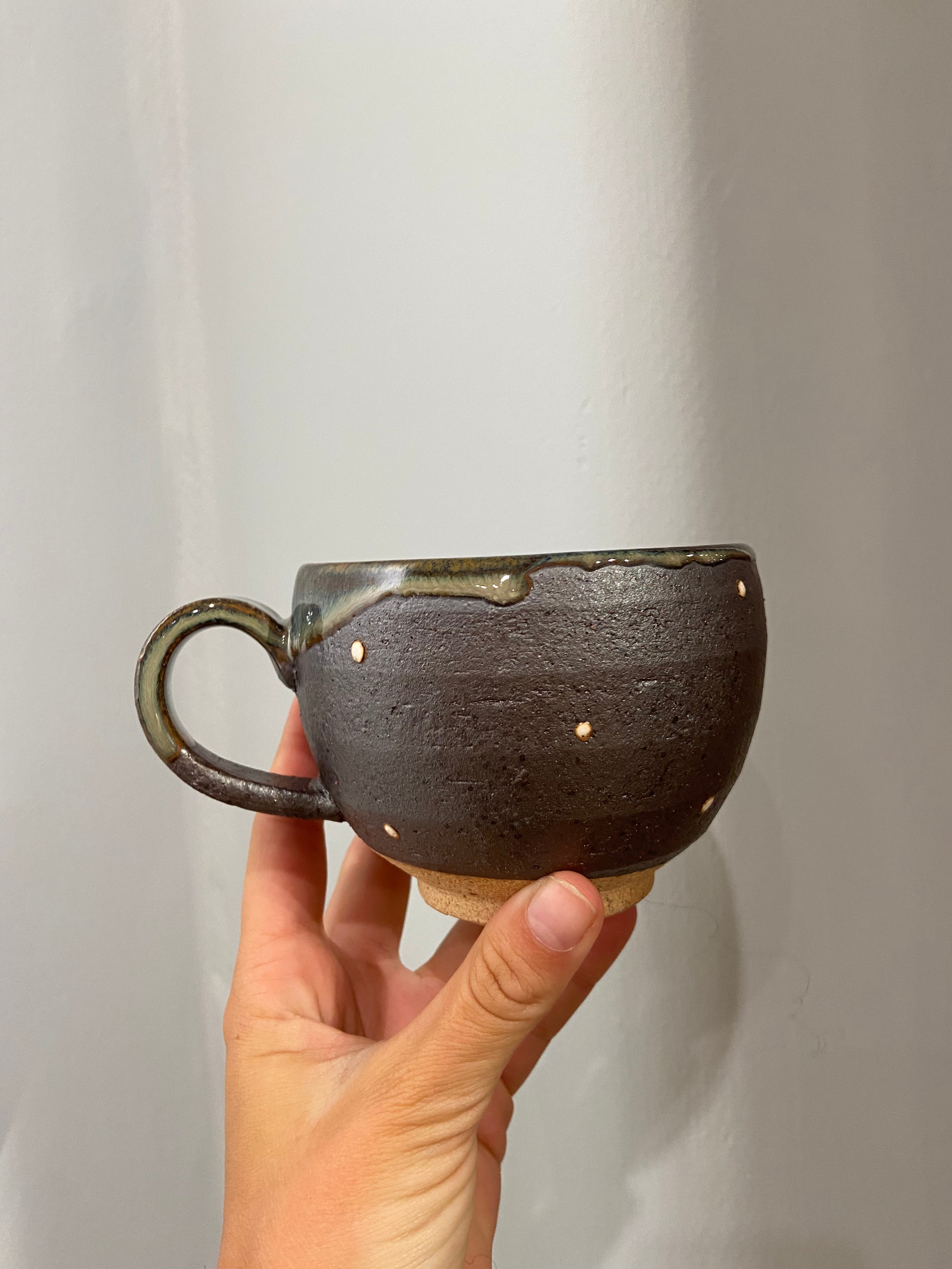 Cup with brown glaze and white dots